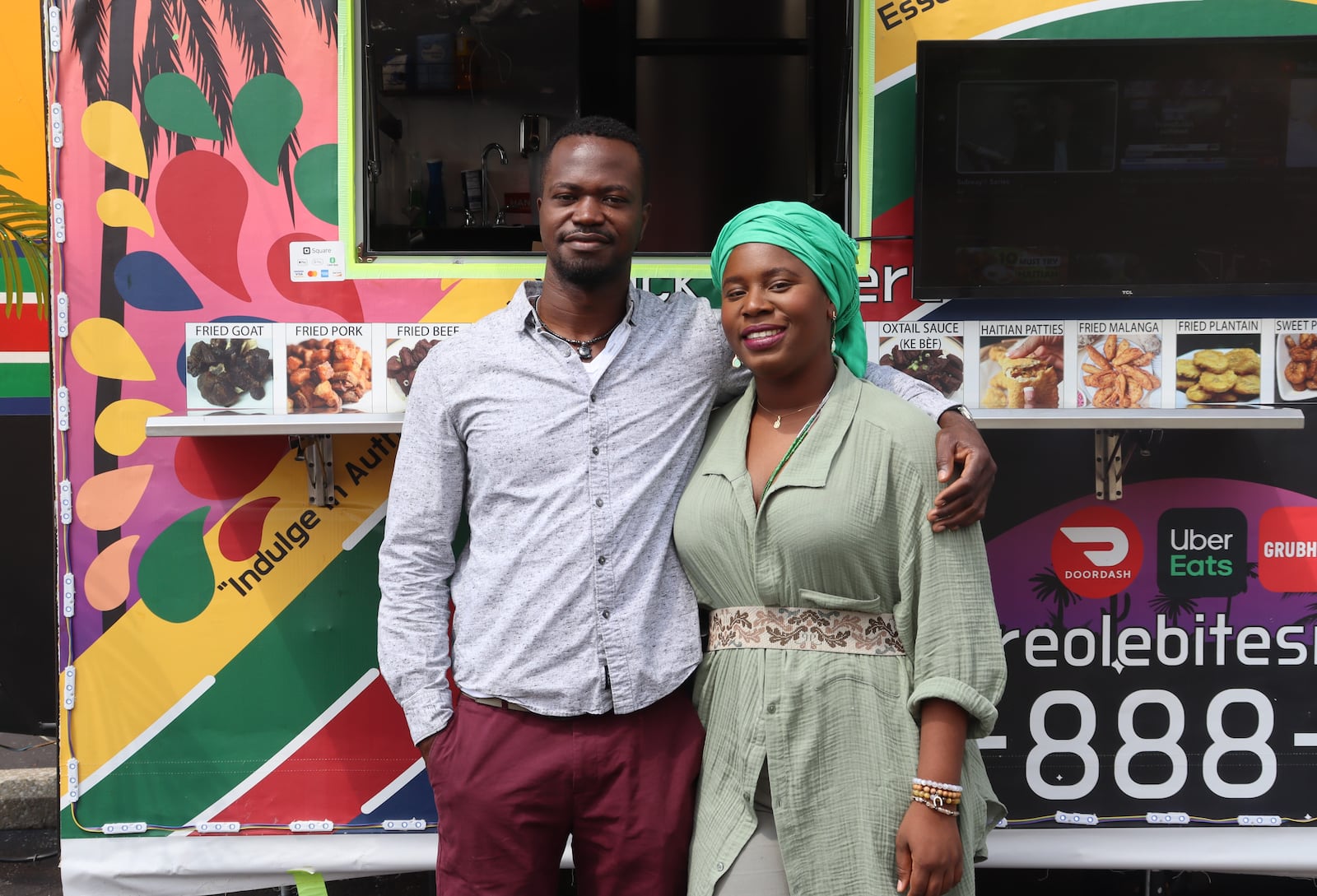 Michael Moiyallah and Marie Morett pose in front of the new Haitian food truck, Creole Bites, on Friday, Aug. 11, 2023. JESSICA OROZCO/STAFF