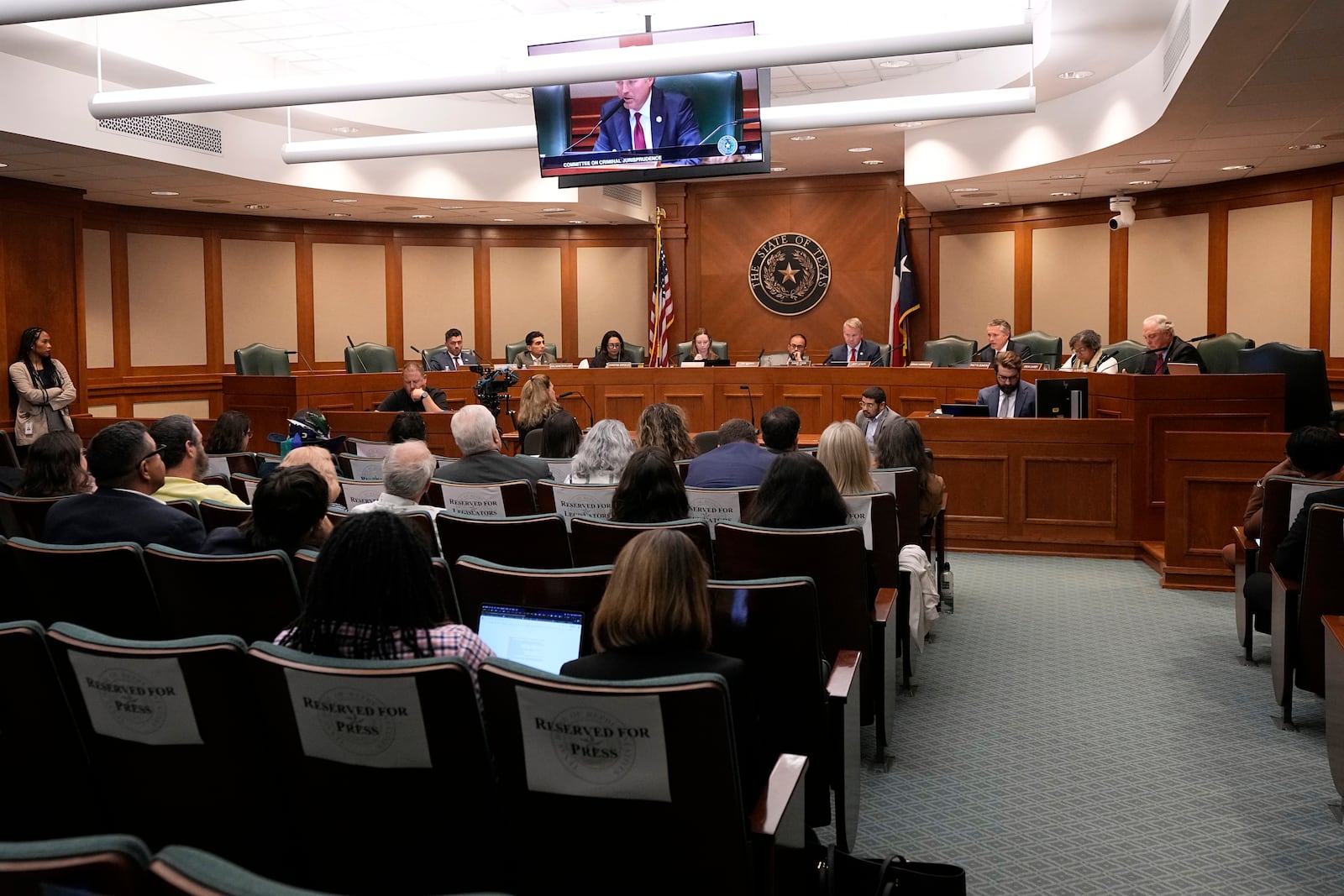 The state House Committee on Criminal Jurisprudence listens to testimony from Terre Compton, sitting at table center left, a resident of Palestine, Texas, and a member of the jury that convicted Robert Roberson, Monday, Oct. 21, 2024, in Austin, Texas. (AP Photo/Tony Gutierrez)