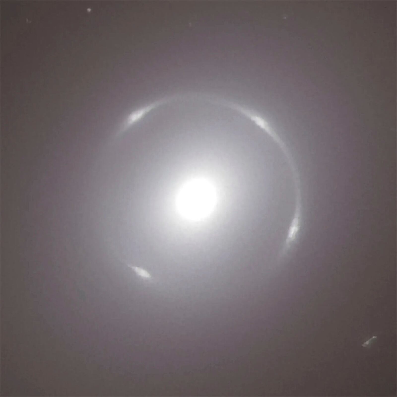 This photo provided by the European Space Agency shows a close-up view of the center of the NGC 6505 galaxy, with the bright Einstein ring aligned with it, captured by European Space Agency's Euclid space telescope. (European Space Agency via AP)