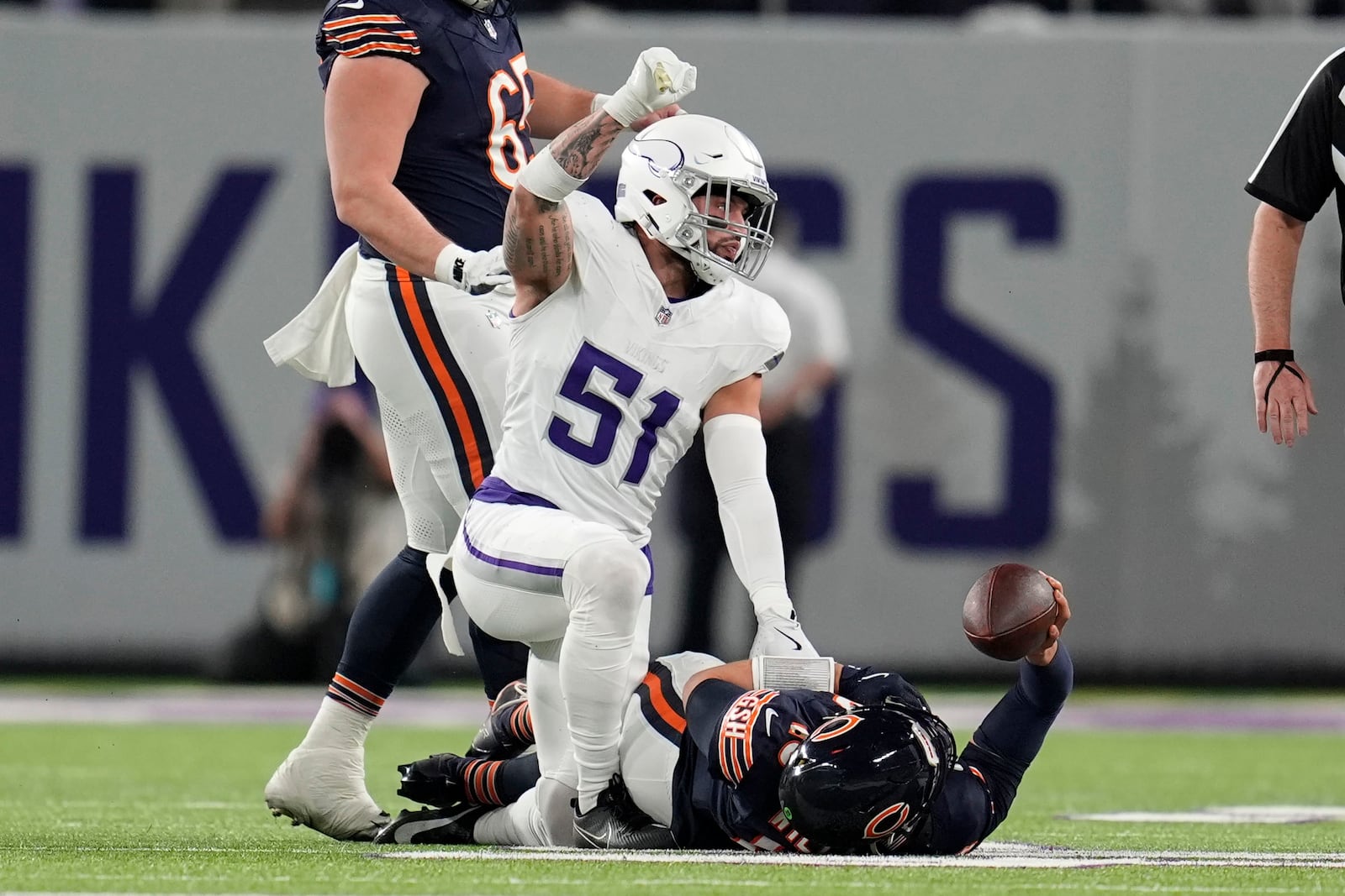 Minnesota Vikings linebacker Blake Cashman (51) celebrates a defensive stop during the first half of an NFL football game against the Chicago Bears, Monday, Dec. 16, 2024, in Minneapolis. (AP Photo/Abbie Parr)