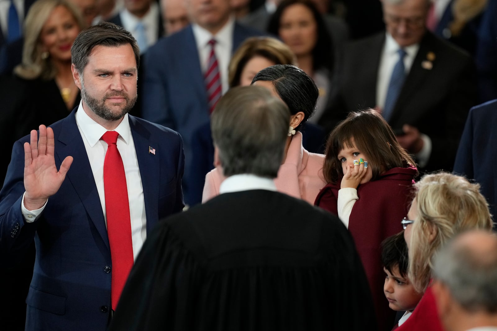 JD Vance is sworn in as vice president by Supreme Court Justice Brett Kavanaugh as Usha Vance holds the Bible during the 60th Presidential Inauguration in the Rotunda of the U.S. Capitol in Washington, Monday, Jan. 20, 2025. (AP Photo/Julia Demaree Nikhinson, Pool)