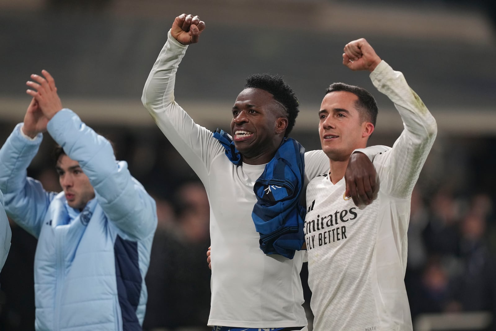 Real Madrid players celebrate at the end of the Champions League opening phase soccer match between Atalanta and Real Madrid at the Bergamo's stadium, in Bergamo, Italy, Tuesday, Dec. 10, 2024. (AP Photo/Antonio Calanni)