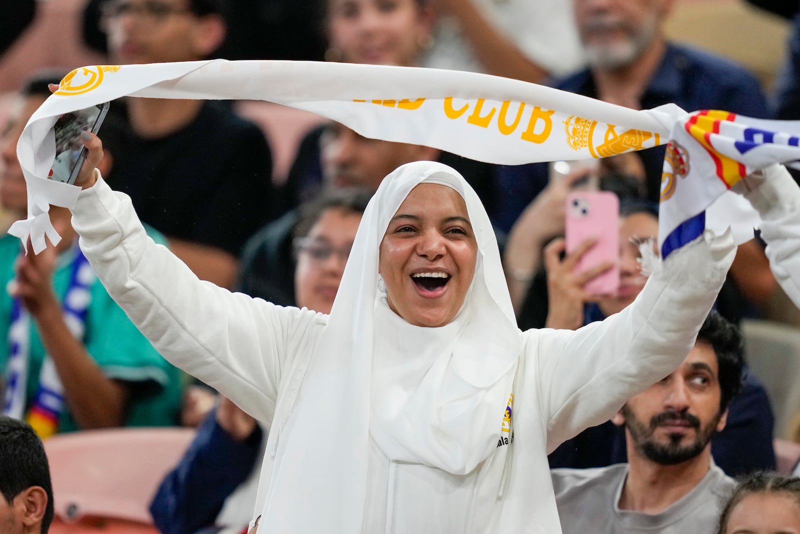 A supporter cheers before the Spanish Super Cup semifinal soccer match between Real Madrid and Mallorca at the King Abdullah Stadium in Jeddah, Saudi Arabia, Thursday, Jan. 9, 2025. (AP Photo/Altaf Qadri)