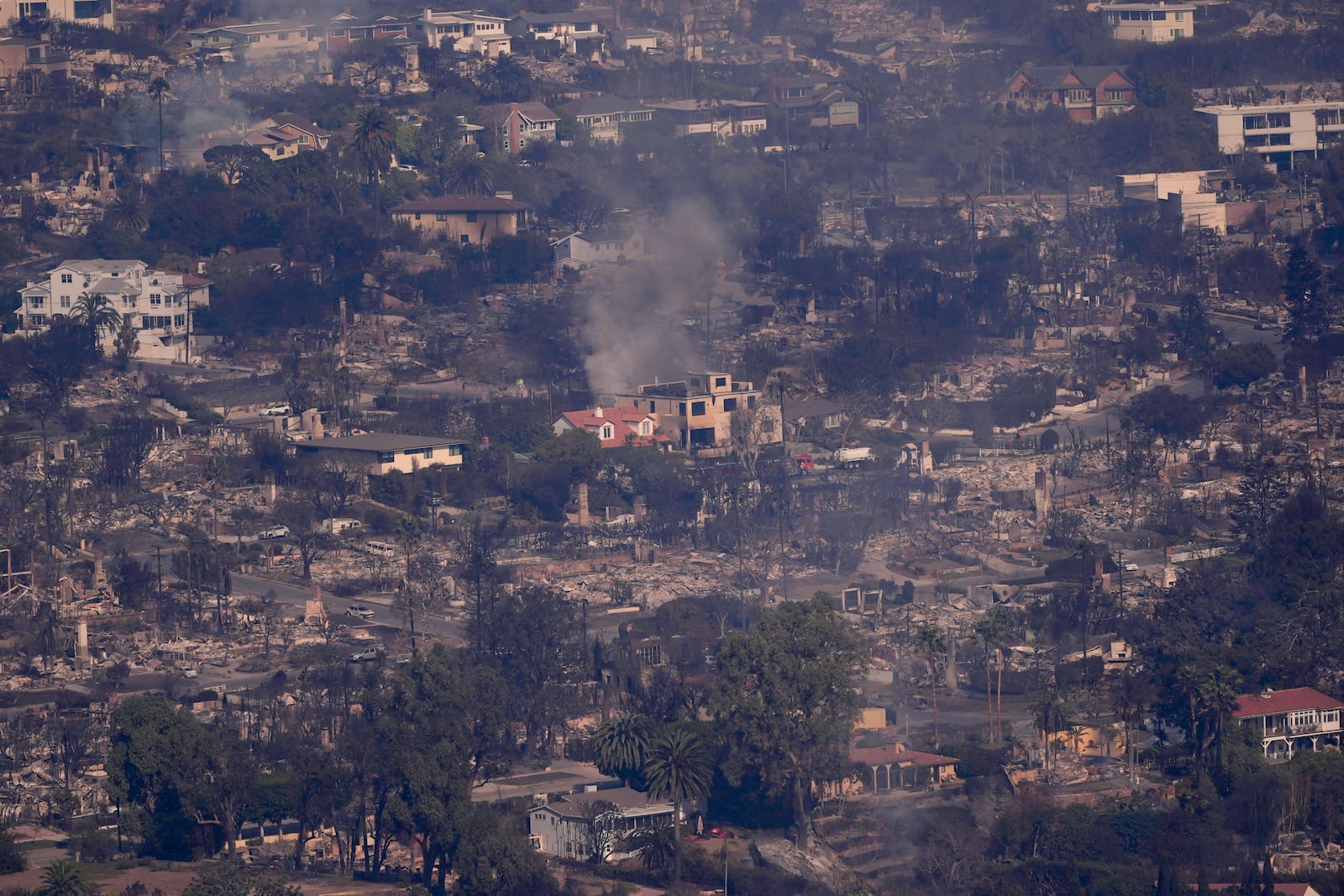 The devastation from the Palisades Fire is seen from the air in the Pacific Palisades neighborhood of Los Angeles, Thursday, Jan. 9, 2025. (AP Photo/Mark J. Terrill)