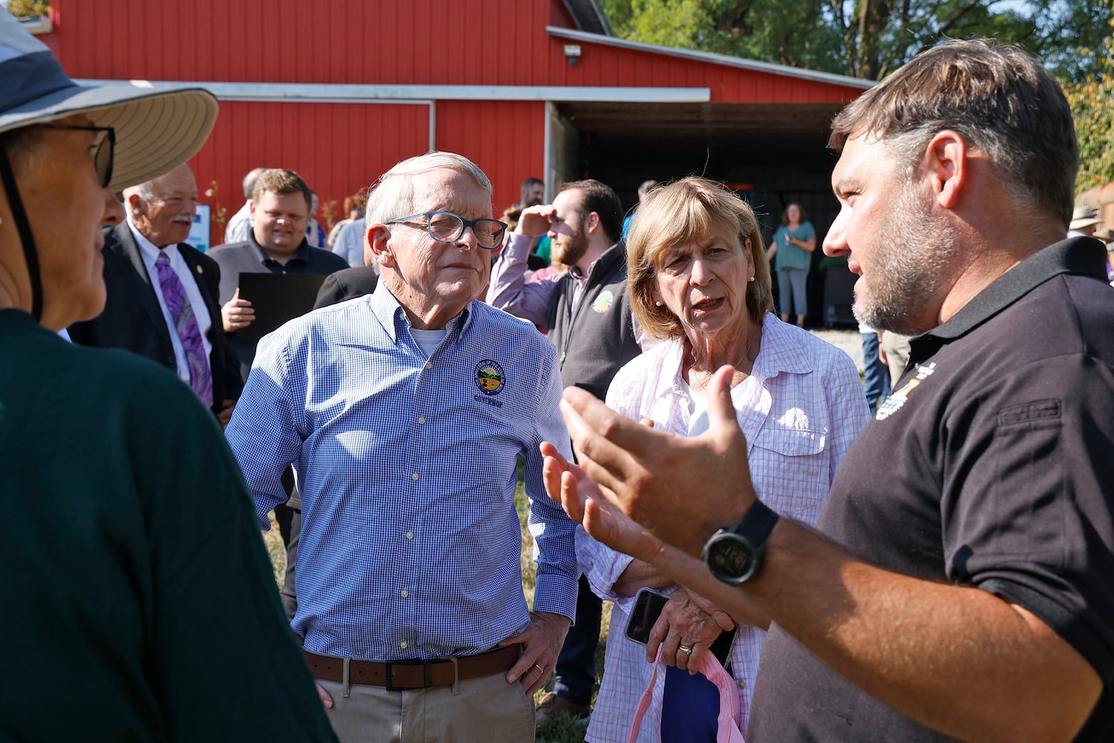 Gov. Mike DeWine and his wife, Fran, talk with Donnie Knight, from the U.S. Fish and Wildlife Services, about the new H2Ohio Rainbow Run Wetland on Old Clifton Road in Clark County Wednesday, Sept. 11, 2024. BILL LACKEY/STAFF