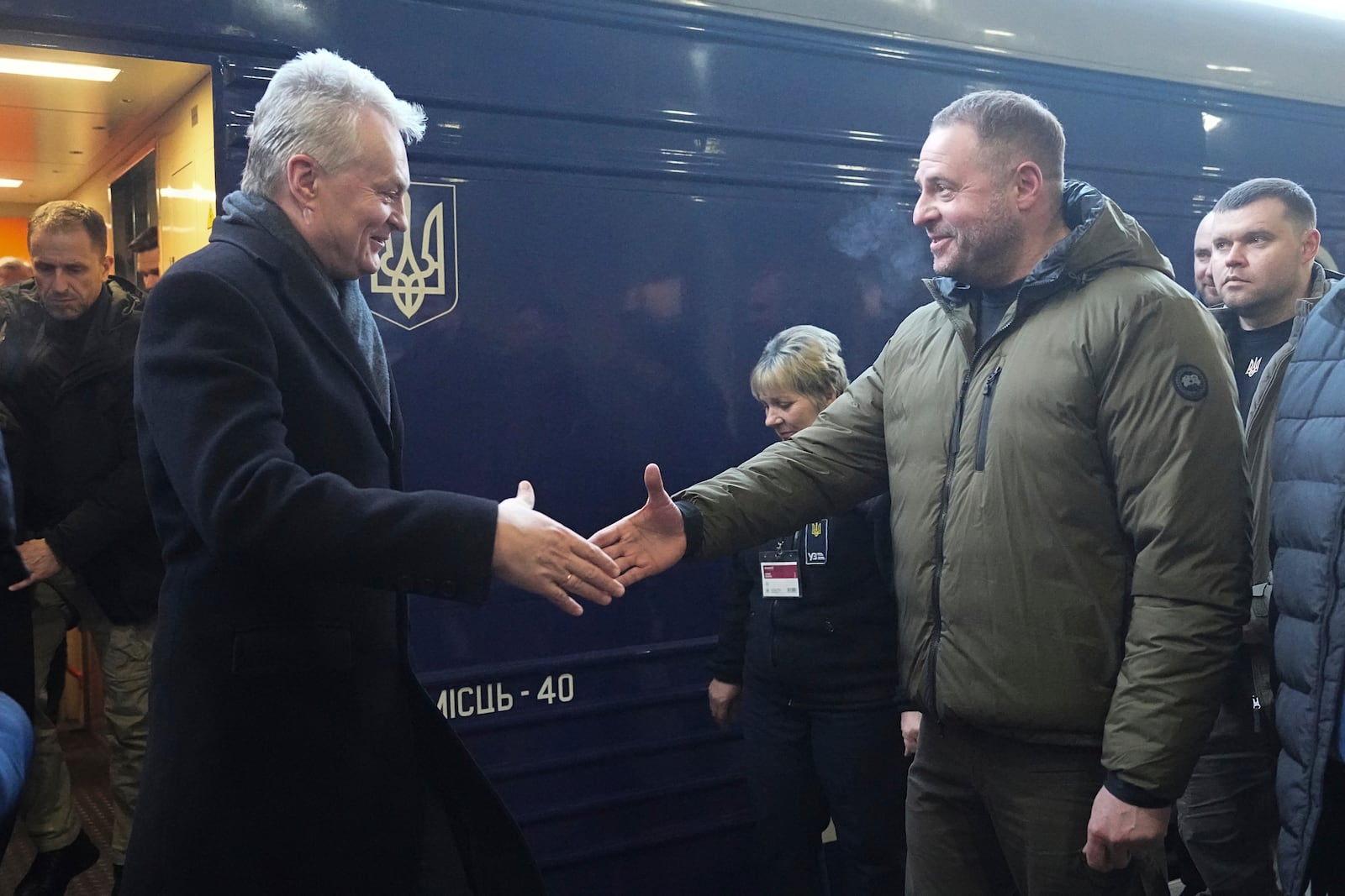 Lithuanian President Gitanas Nauseda, left, arrives at train station on the third anniversary of the Russian invasion of Ukraine, Kyiv, Ukraine, Monday, Feb. 24, 2025. (AP Photo/Efrem Lukatsky)