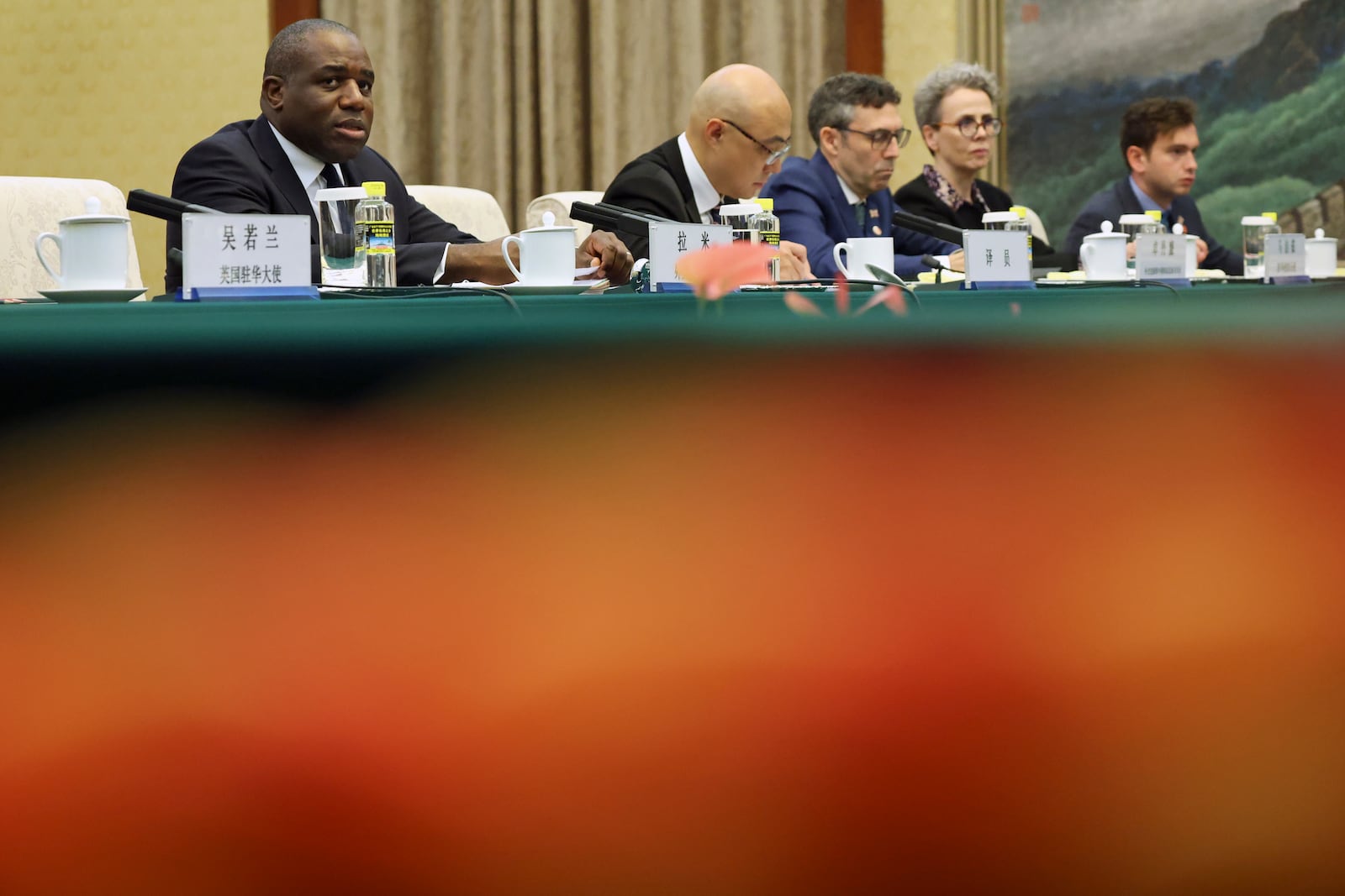 Britain's Foreign Secretary David Lammy, left, attends a meeting with Chinese Vice Premier Ding Xuexiang, not pictured, at the Great Hall of the People in Beijing Friday, Oct. 18, 2024. (Florence Lo/Pool Photo via AP)