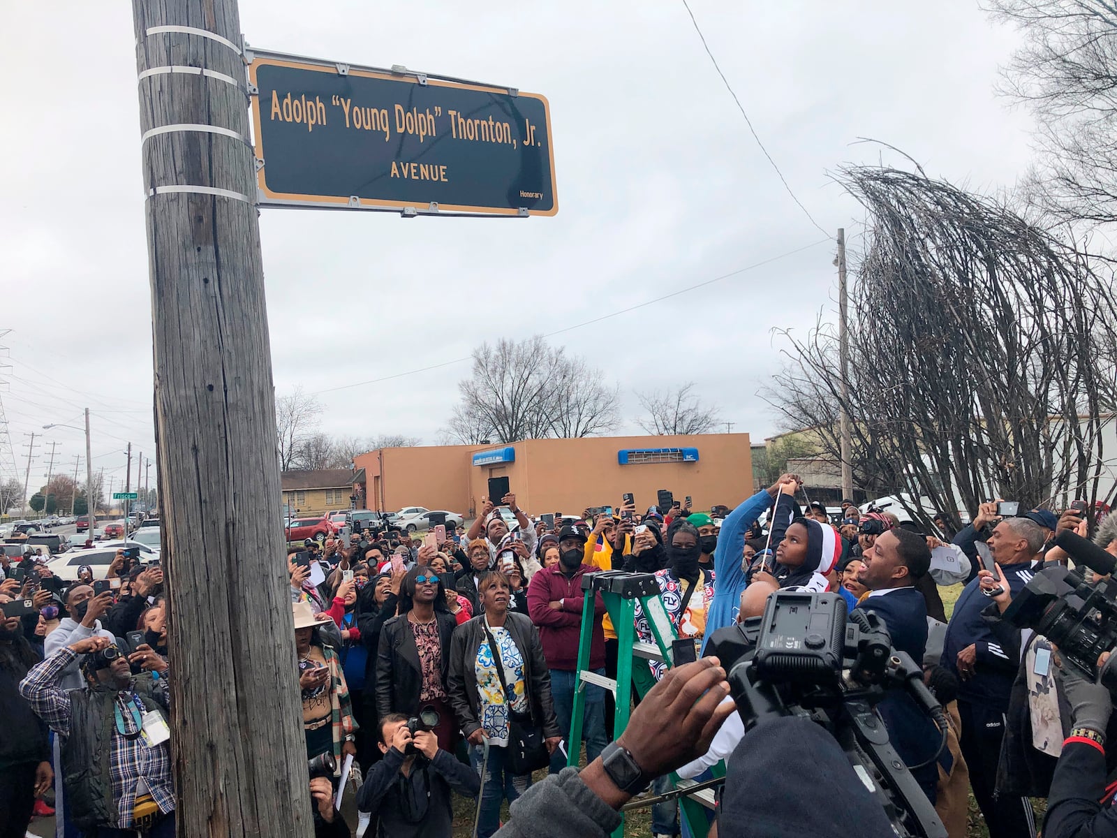 FILE - A street sign is unveiled to honor slain rapper Young Dolph, whose real name is Adolph Thornton Jr., on Wednesday, Dec. 15, 2021, in Memphis, Tenn. (AP Photo/Adrian Sainz, File).