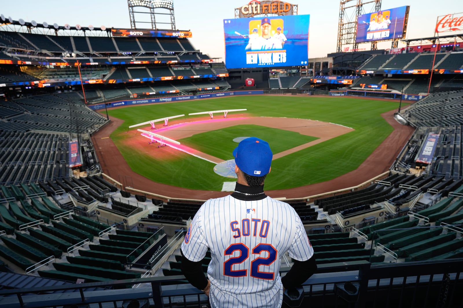 New York Mets' Juan Soto poses for photographs at Citi Field, Thursday, Dec. 12, 2024, in New York. (AP Photo/Frank Franklin II)