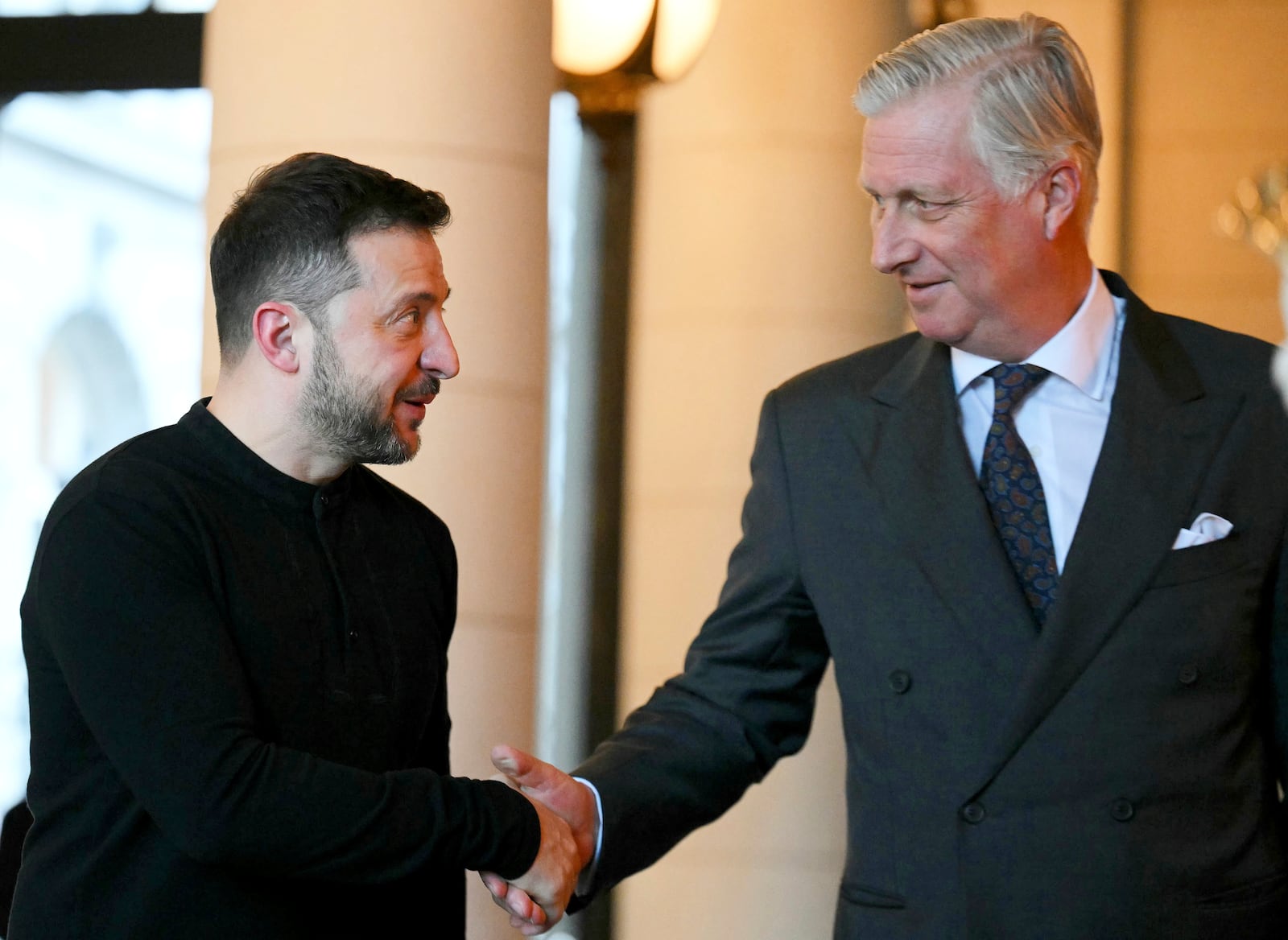 Belgium's King Philippe, right, greets Ukraine's President Volodymyr Zelenskyy prior to a meeting at the Royal Palace in Brussels, Thursday, March 6, 2025. (AP Photo/Nicolas Tucat, Pool Photo via AP)