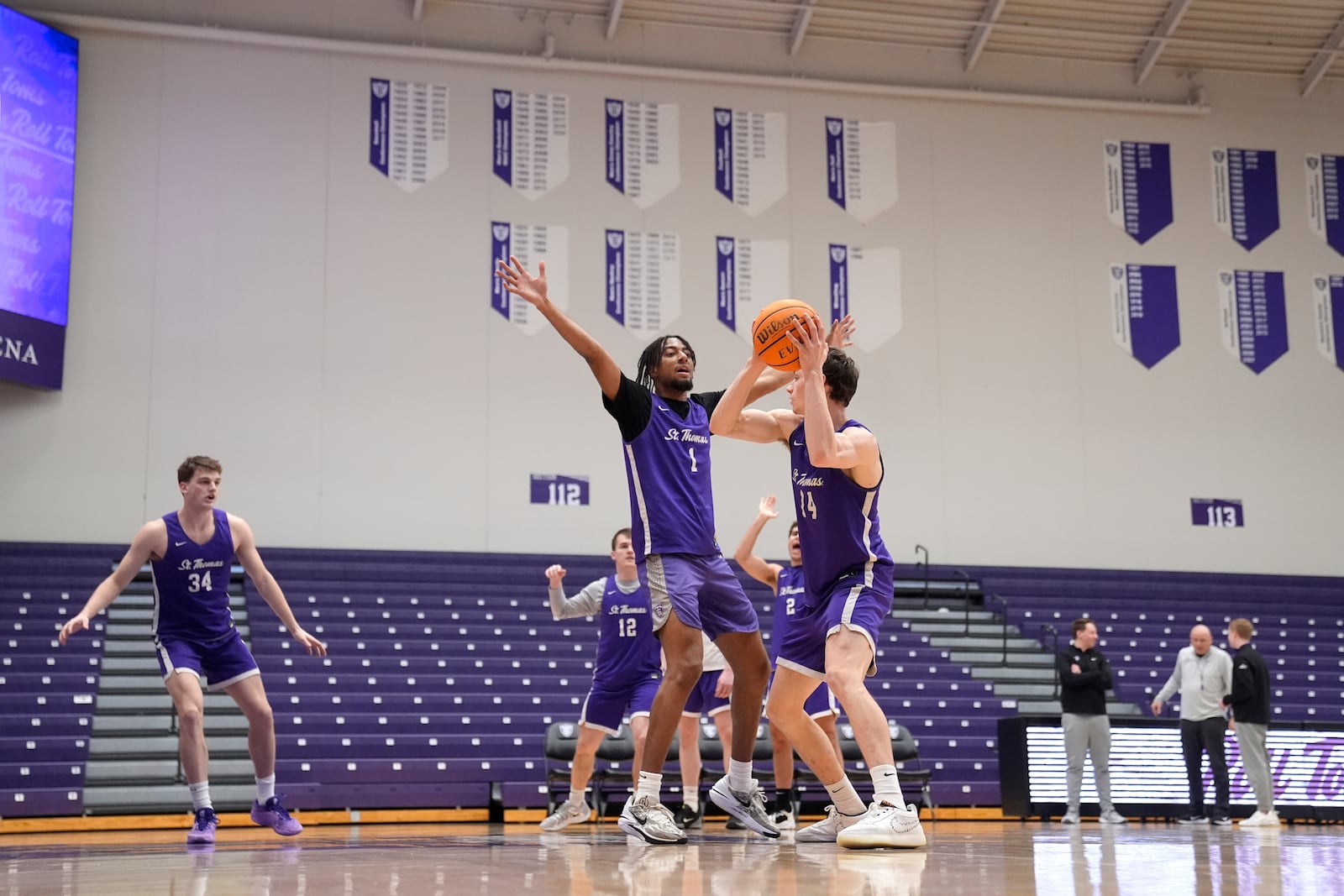 St. Thomas guards Kendall Blue (1) and Miles Barnstable (14) take part in drills during NCAA college basketball practice, Wednesday, Feb. 26, 2025, in St. Paul, Minn. (AP Photo/Abbie Parr)