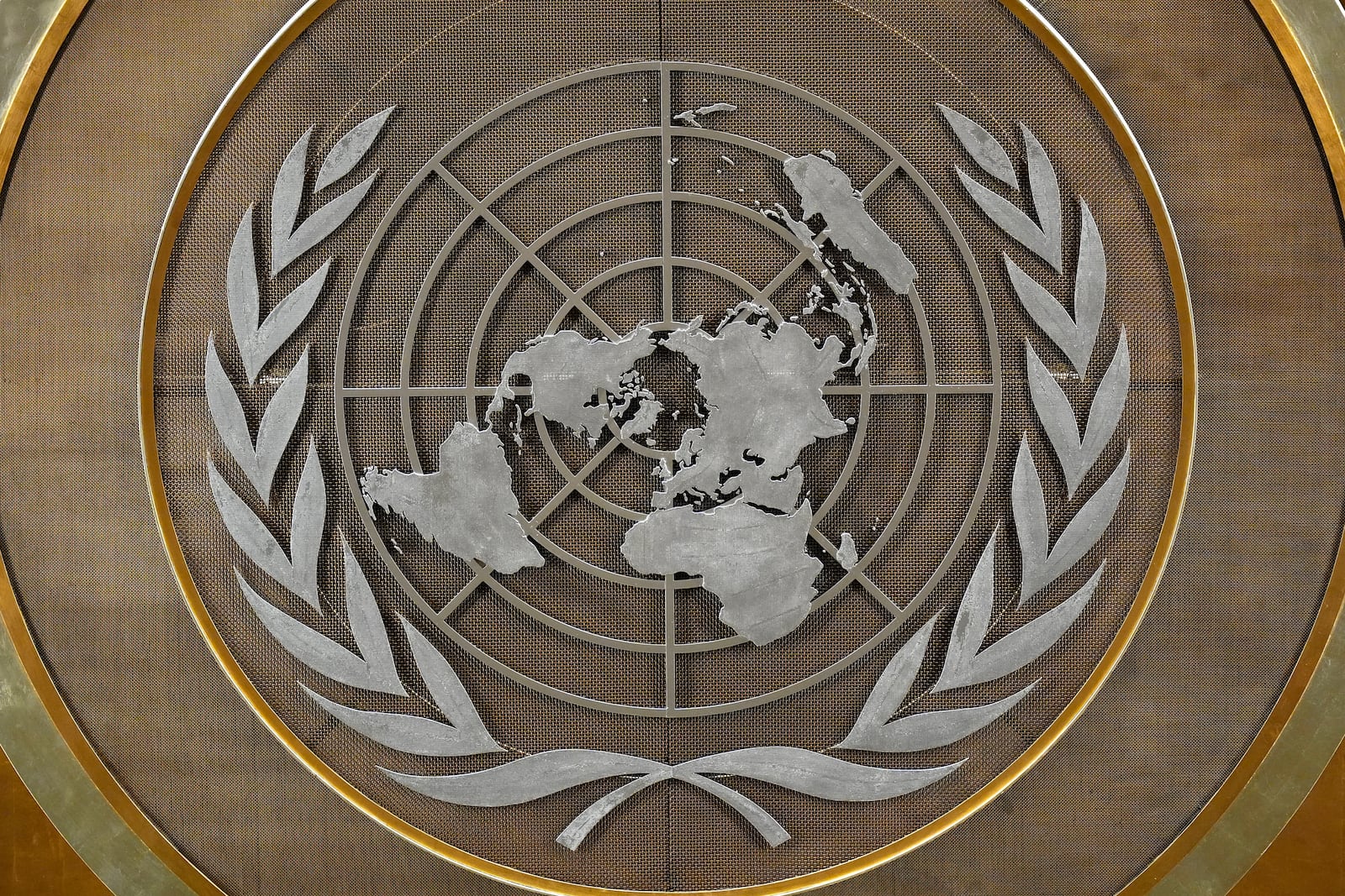 FILE - The United Nations logo is seen inside the 79th session of the United Nations General Assembly, Tuesday, Sept. 24, 2024. (AP Photo/Pamela Smith, File)