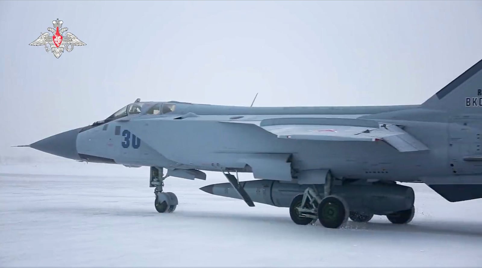 FILE - This image taken from video released by the Russian Defense Ministry Press Service on Feb. 19, 2022, shows a MiG-31K fighter of the Russian air force carrying a Kinzhal hypersonic cruise missile parked at an air field during a military drills. (Russian Defense Ministry Press Service via AP, File)