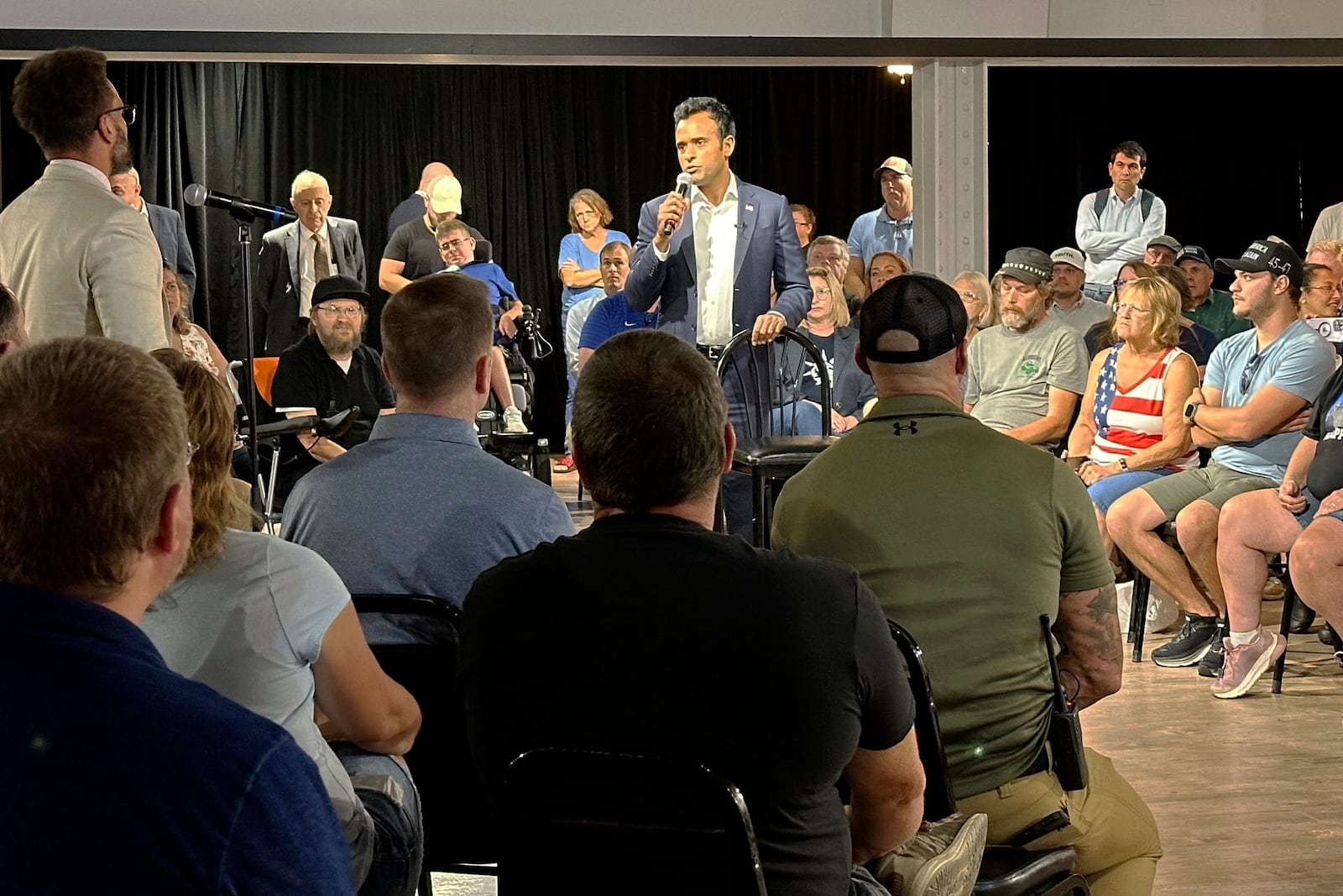 FILE - Biotech entrepreneur and former Republican presidential candidate Vivek Ramaswamy, center, speaks at a town hall, Sept. 19, 2024, in Springfield, Ohio. (AP Photo/Julie Carr Smyth, File)