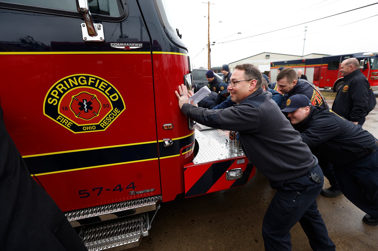 Springfield Fire Chief Jacob King and members of the Springfield Fire Division push in a new engine Thursday, Feb. 6, 2024 to station five on Commerce Dr. MARSHALL GORBY\STAFF