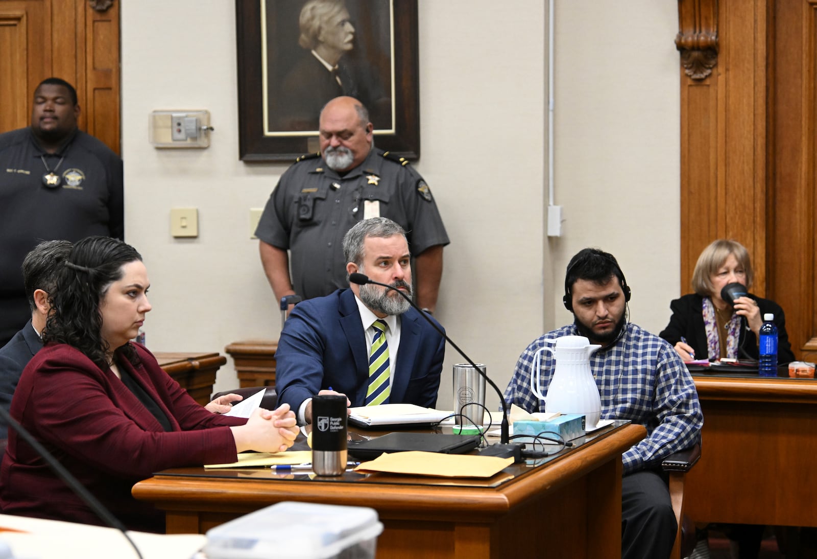 Jose Ibarra, right, accused of killing a Georgia nursing student earlier this year, listens through an interpreter as he sits with his attorneys Dustin Kirby, second left, and Kaitlyn Beck, left, during his trial at Athens-Clarke County Superior Court, Friday, Nov. 15, 2024, in Athens, Ga. (Hyosub Shin/Atlanta Journal-Constitution via AP, Pool)