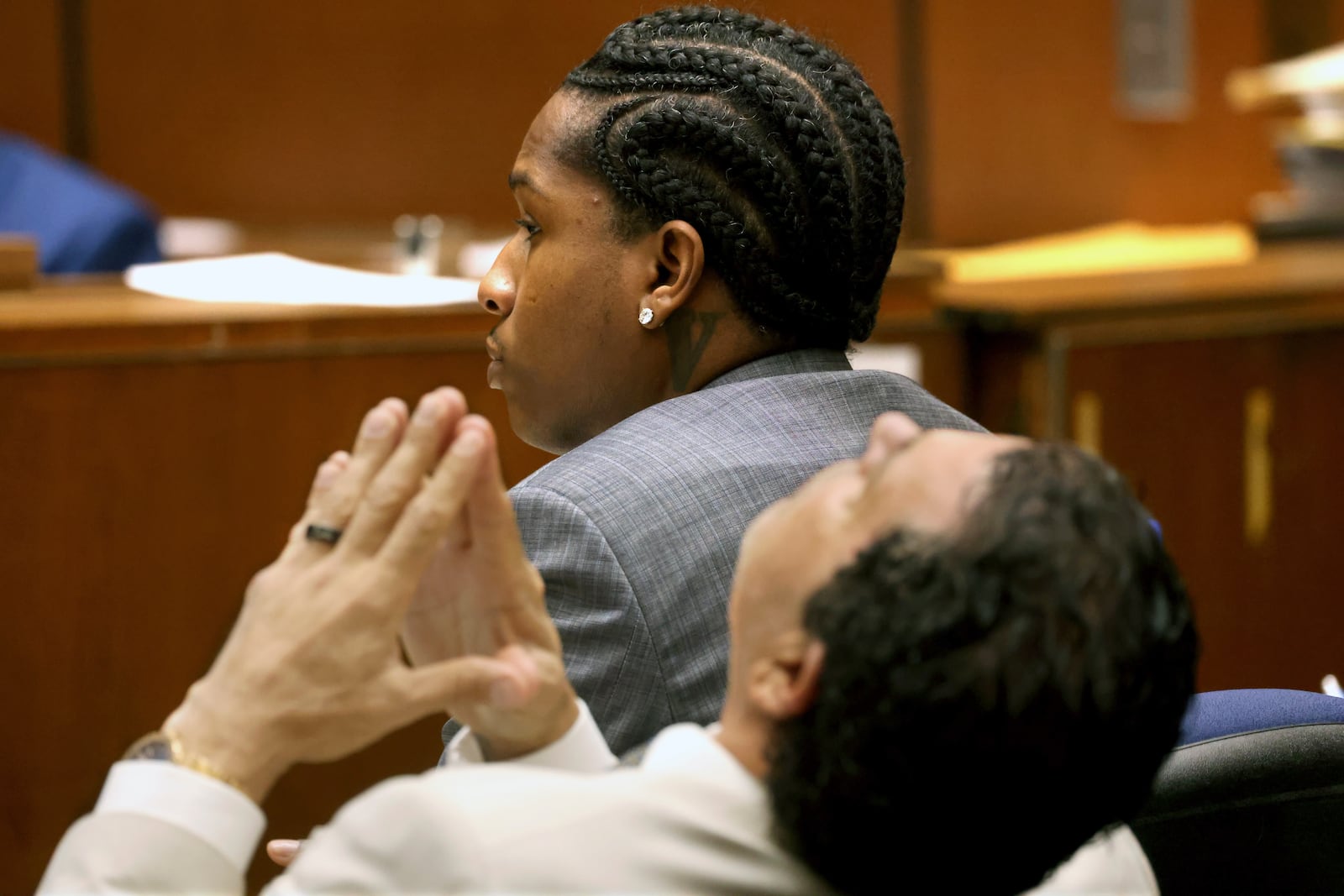 Rakim Mayers, aka A$AP Rocky, and his attorney Joe Tacopina listen to opening remarks by the prosecuting attorney in Mayers' trial at the Clara Shortridge Foltz Criminal Justice Center in downtown Los Angeles, Friday, Jan. 24, 2025. (Genaro Molina/Los Angeles Times via AP, Pool)