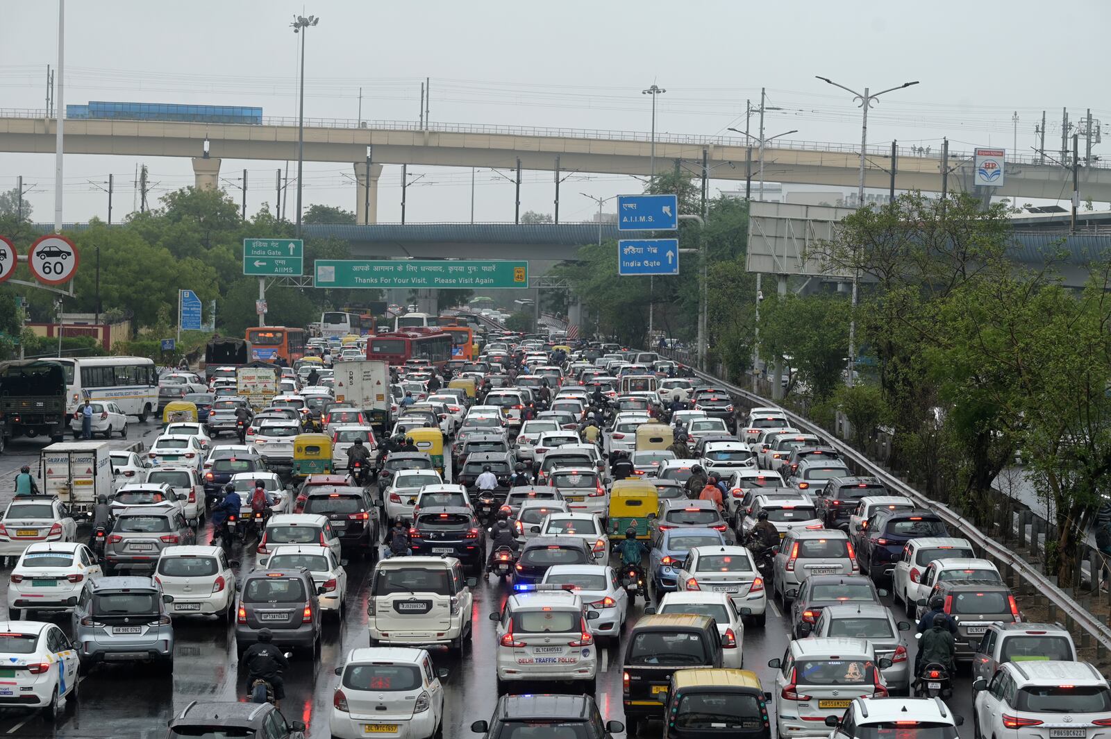 FILE - Vehicles are stuck in traffic on a highway near the Indira Gandhi International Airport after a heavy downpour disrupted vehicular movement in New Delhi, India, June 28, 2024. (AP Photo, File)