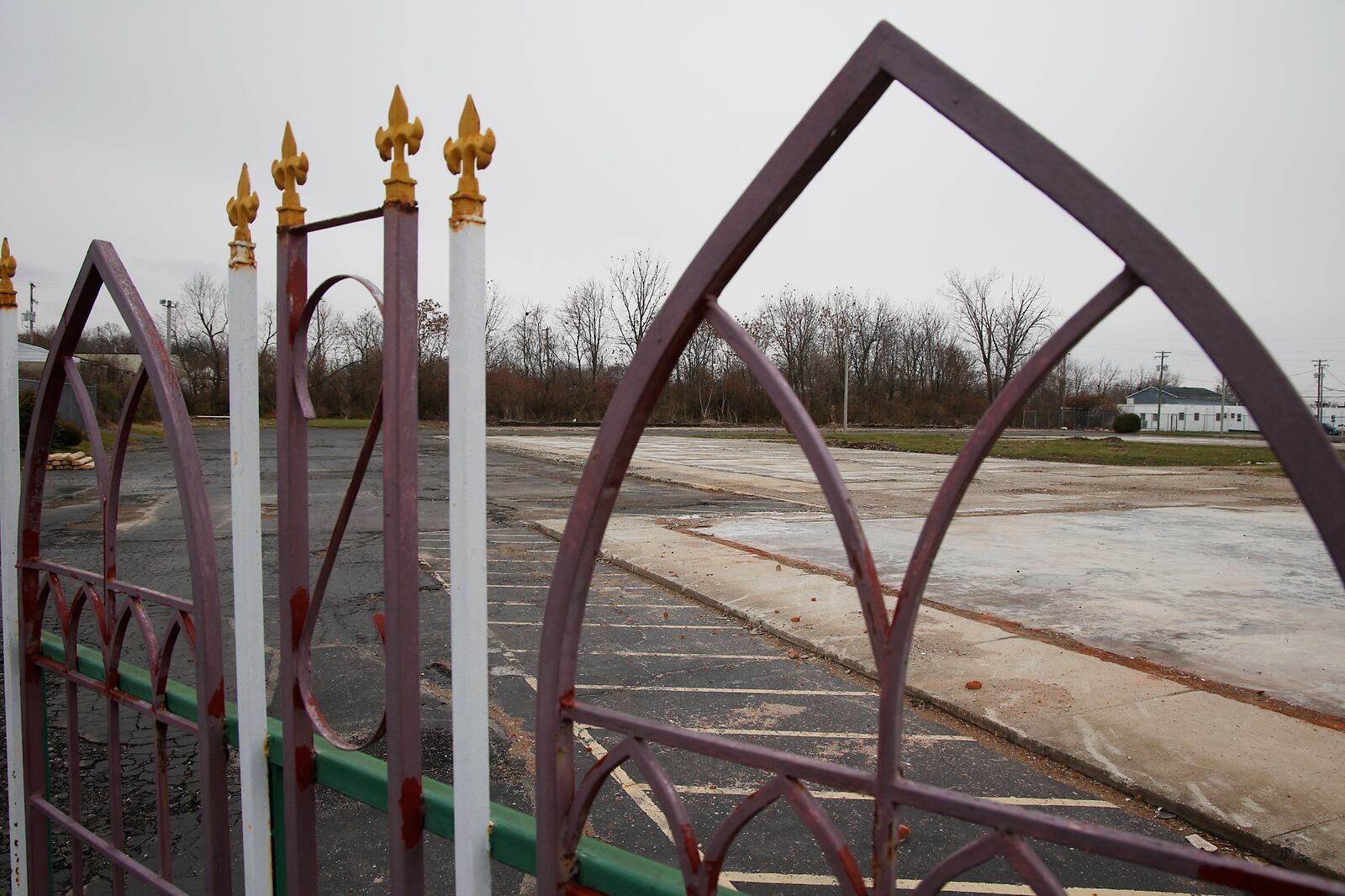 A metal gate is all that's left of the Villager Inn Monday, Dec. 4, 2023. The City of Springfield had the hotel demolished after a fire earlier this year. BILL LACKEY/STAFF