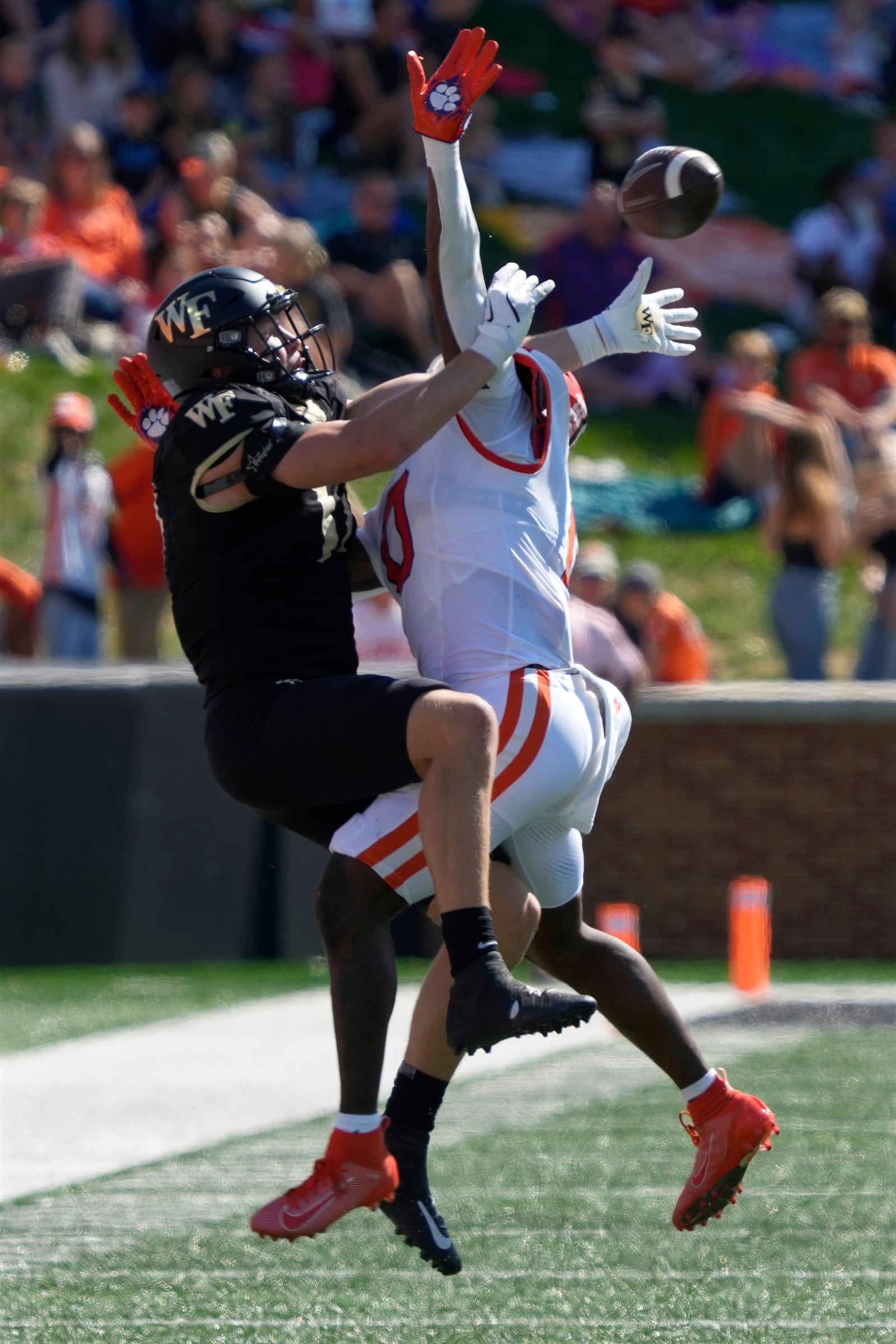 Clemson linebacker Barrett Carter, right, blocks a catch by Wake Forest tight end Michael Frogge, left, during the first half of an NCAA football game in Greensboro, N.C., Saturday, Oct. 12, 2024. Carter was called for pass interference on the play. (AP Photo/Chuck Burton)