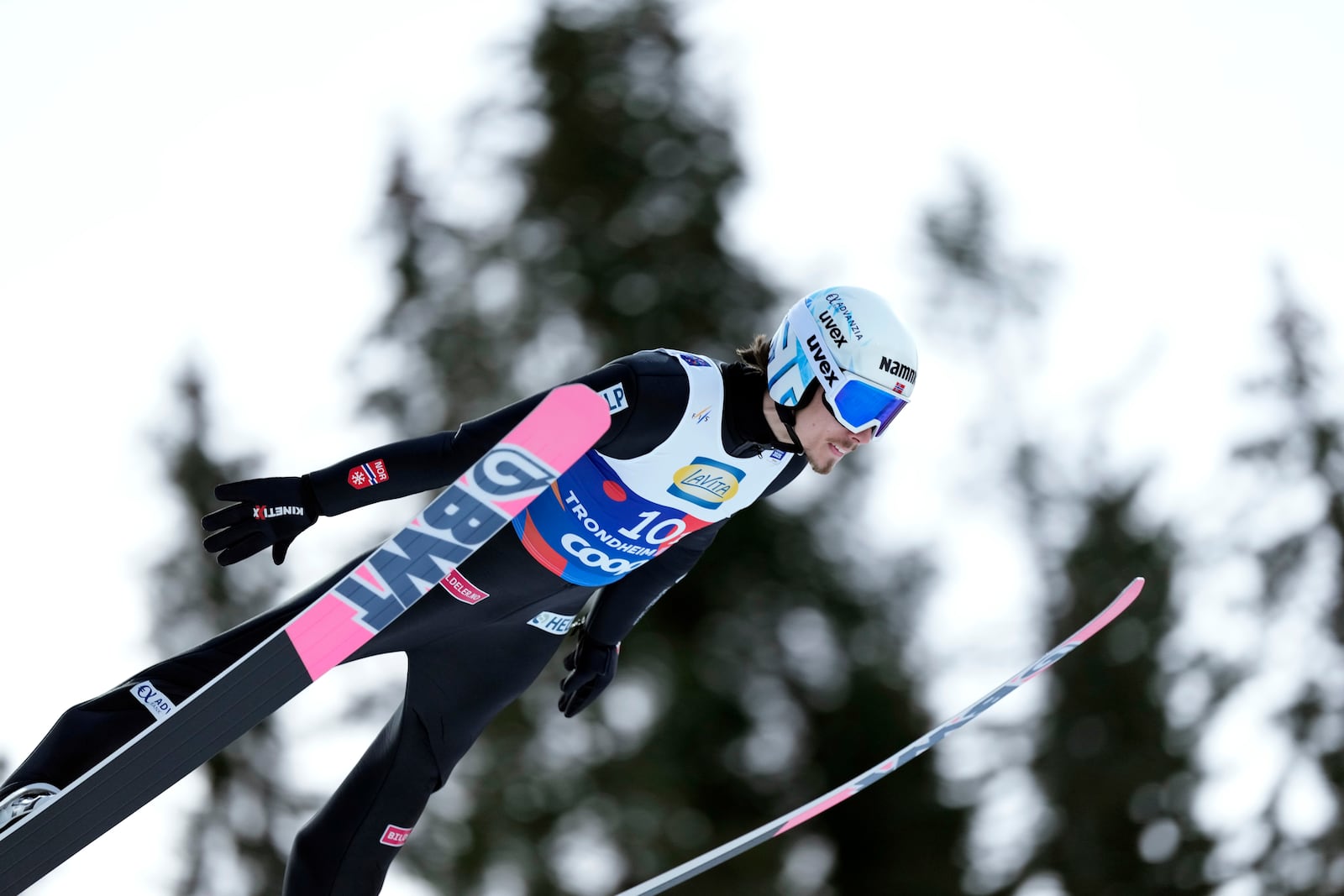 Johann Andre Forfang, of Norway, soars through the air during his first round jump of the ski jumping men's team large hill competition at the Nordic World Ski Championships in Trondheim, Norway, Thursday, March 6, 2025. (AP Photo/Matthias Schrader)