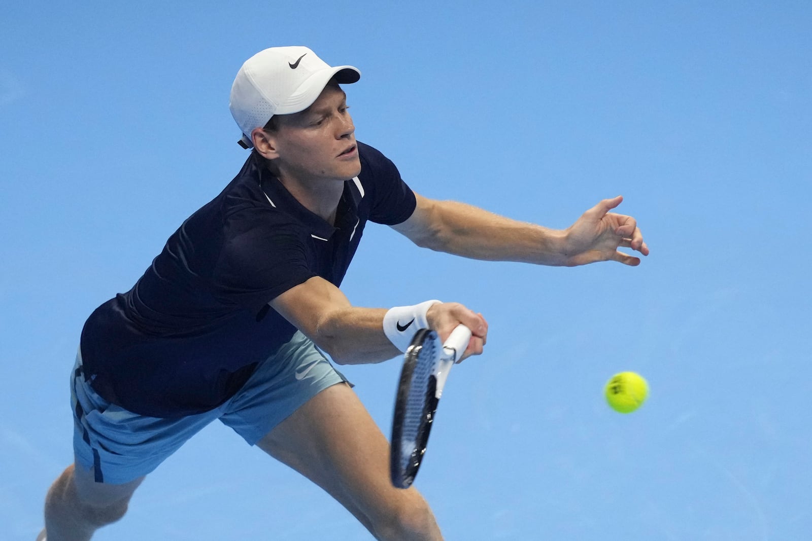 Italy's Jannik Sinner returns the ball to United States' Taylor Fritz during their singles tennis match of the ATP World Tour Finals at the Inalpi Arena, in Turin, Italy, Tuesday, Nov. 12, 2024. (AP Photo/Antonio Calanni)