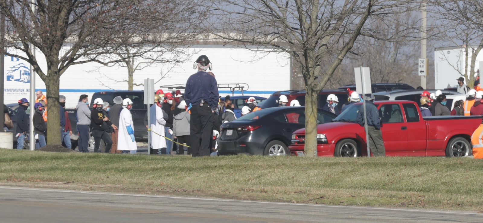 Dole employees wait outside the plant Wednesday after a chemical leak was reported. STAFF/BILL LACKEY