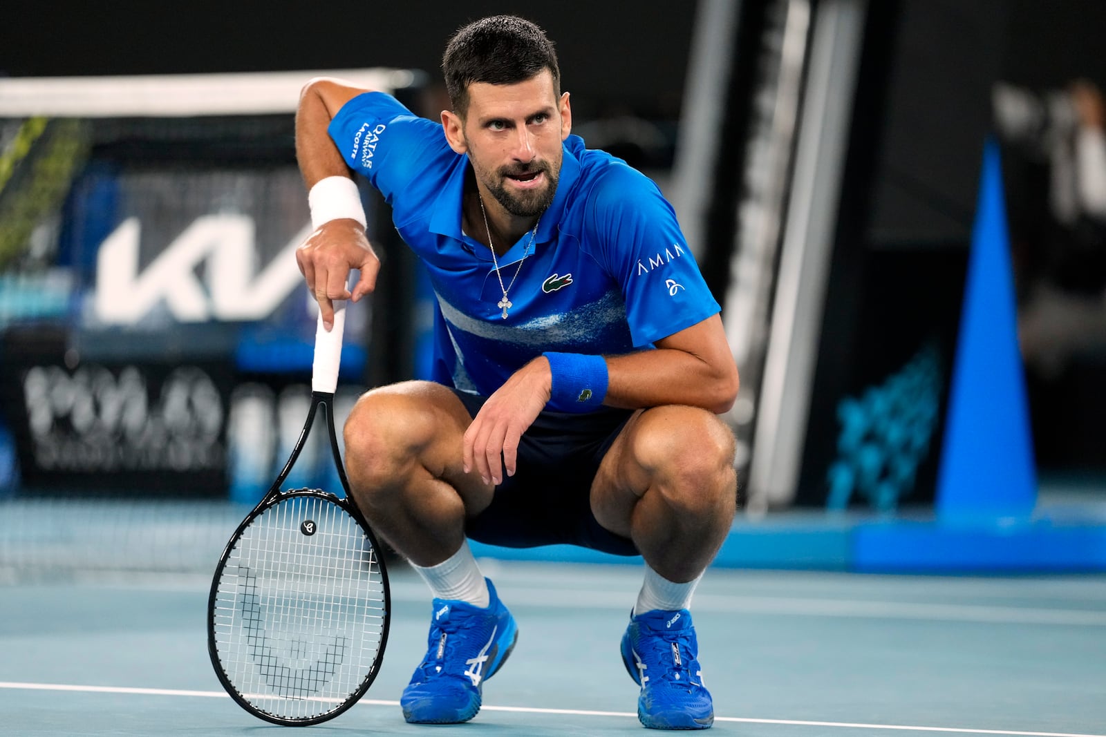 Novak Djokovic of Serbia reacts during his quarterfinal match against Carlos Alcaraz of Spain at the Australian Open tennis championship in Melbourne, Australia, Tuesday, Jan. 21, 2025. (AP Photo/Asanka Brendon Ratnayake)