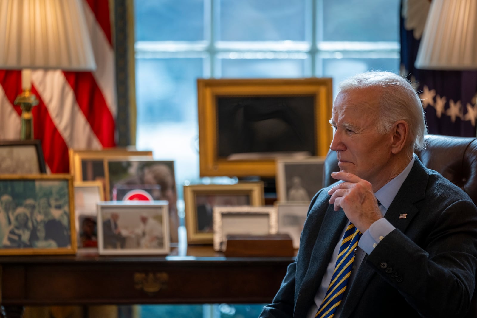 President Joe Biden listens during a briefing regarding the federal response to the spread of wildfires in the Los Angeles area, Friday, Jan. 10, 2025, in the Oval Office at the White House in Washington. (AP Photo/Ben Curtis)