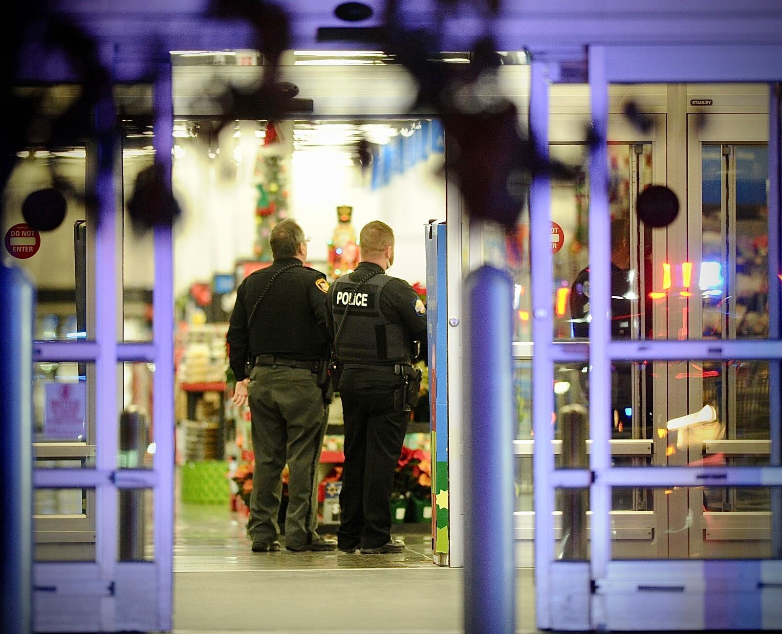 Police respond to the scene of a shooting on Monday, Nov. 20, 2023 in Beavercreek, Ohio. Police say a shooter opened fire at a Walmart, wounding four people before apparently killing himself. The attack took place Monday night at a Walmart in Beavercreek, in the Dayton metropolitan area. (Marshall Gorby/Dayton Daily News via AP)