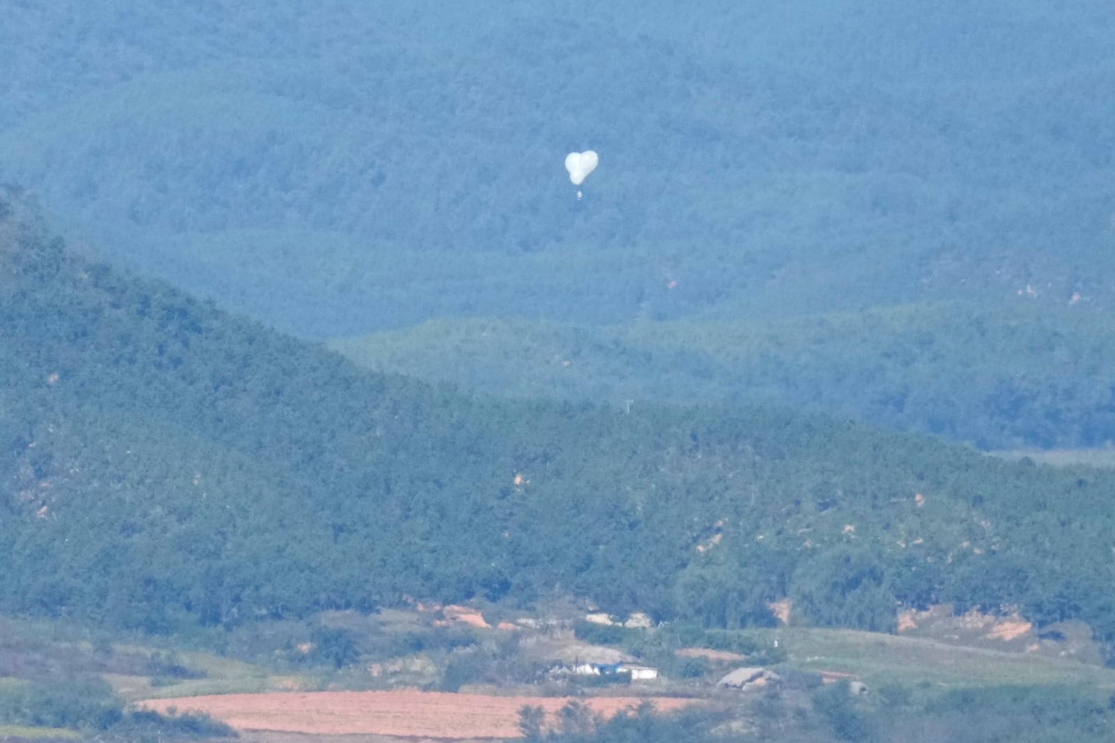 FILE - North Korean balloons are seen from the Unification Observation Post in Paju, South Korea, near the border with North Korea, on Oct. 4, 2024. (AP Photo/Lee Jin-man, File)