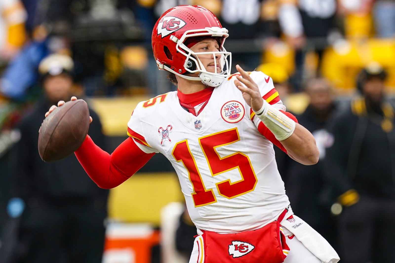 Kansas City Chiefs quarterback Patrick Mahomes (15) passes against the Pittsburgh Steelers during the first half of an NFL football game, Wednesday, Dec. 25, 2024, in Pittsburgh. (AP Photo/Matt Freed)