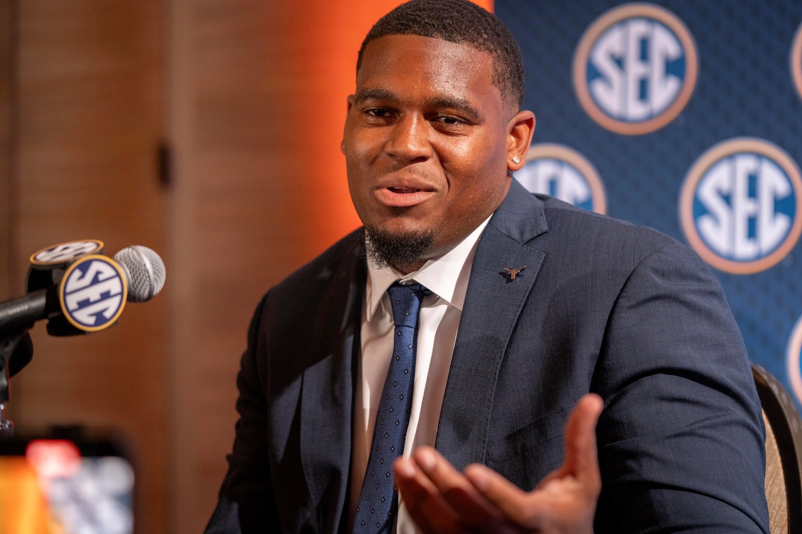 Texas offensive lineman Kelvin Banks Jr. speaks during the Southeastern Conference NCAA college football media days Wednesday, July 17, 2024, in Dallas. (AP Photo/Jeffrey McWhorter)