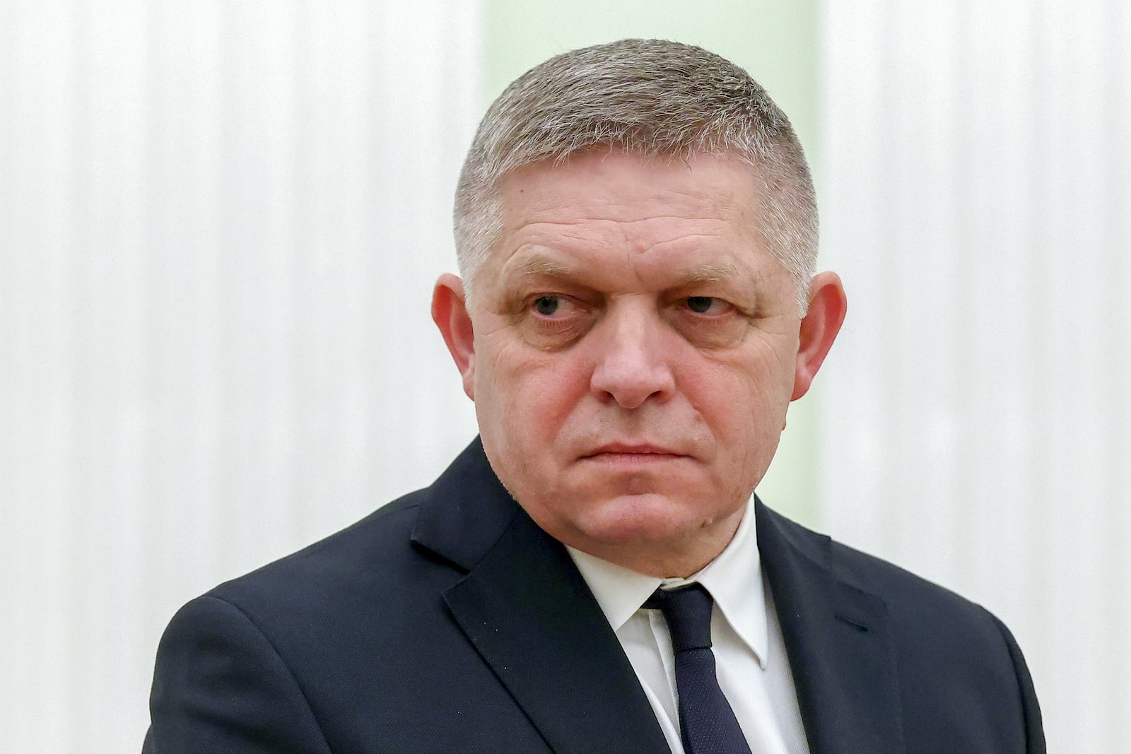 Slovak Prime Minister Robert Fico stands waiting the meeting with Russian President Vladimir Putin at the Kremlin in Moscow, Russia, Sunday, Dec. 22, 2024. (Artyom Geodakyan, Sputnik, Government Pool Photo via AP)