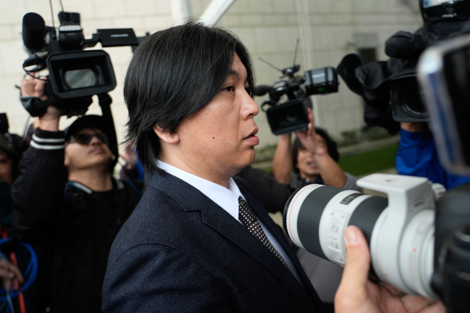 Ippei Mizuhara, former interpreter for Los Angeles Dodgers baseball star Shohei Ohtani arrives at federal court for bank and tax fraud sentencing on Thursday,, Feb. 6, 2025, in Santa Ana, Calif. (AP Photo/Damian Dovarganes)