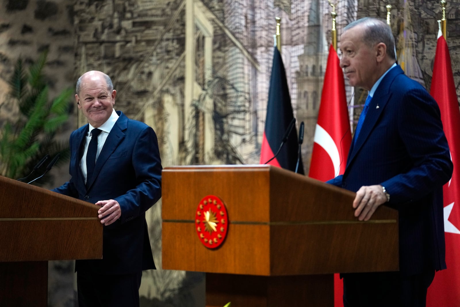 Turkey's President Recep Tayyip Erdogan, right, hold a press conference with Germany's Chancellor Olaf Scholz, in Istanbul, Turkey, Saturday, Oct. 19, 2024. (AP Photo/Khalil Hamra)