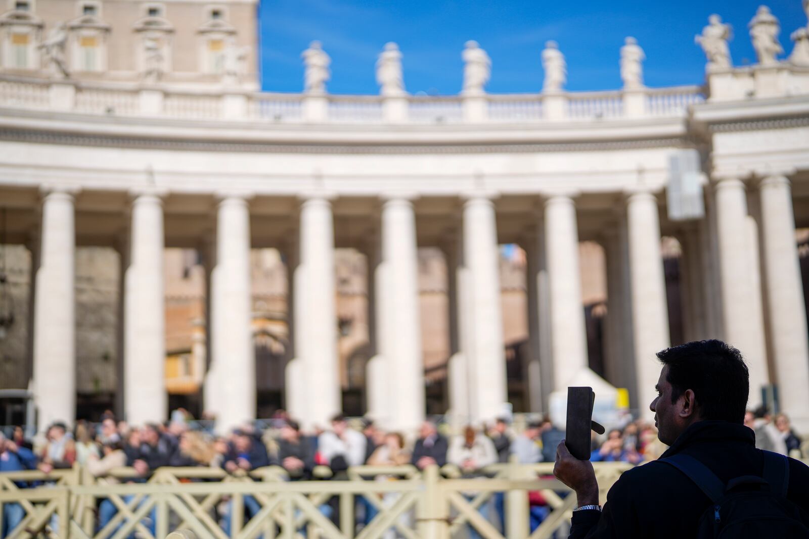 Faithful wait under the closed window of the Apostolic Palace at The Vatican, Sunday, Feb. 16, 2025, from where Pope Francis, who was hospitalised on Friday, blesses the faithful gathered in St. Peter's Square after the Angelus every Sunday. (AP Photo/Gregorio Borgia)