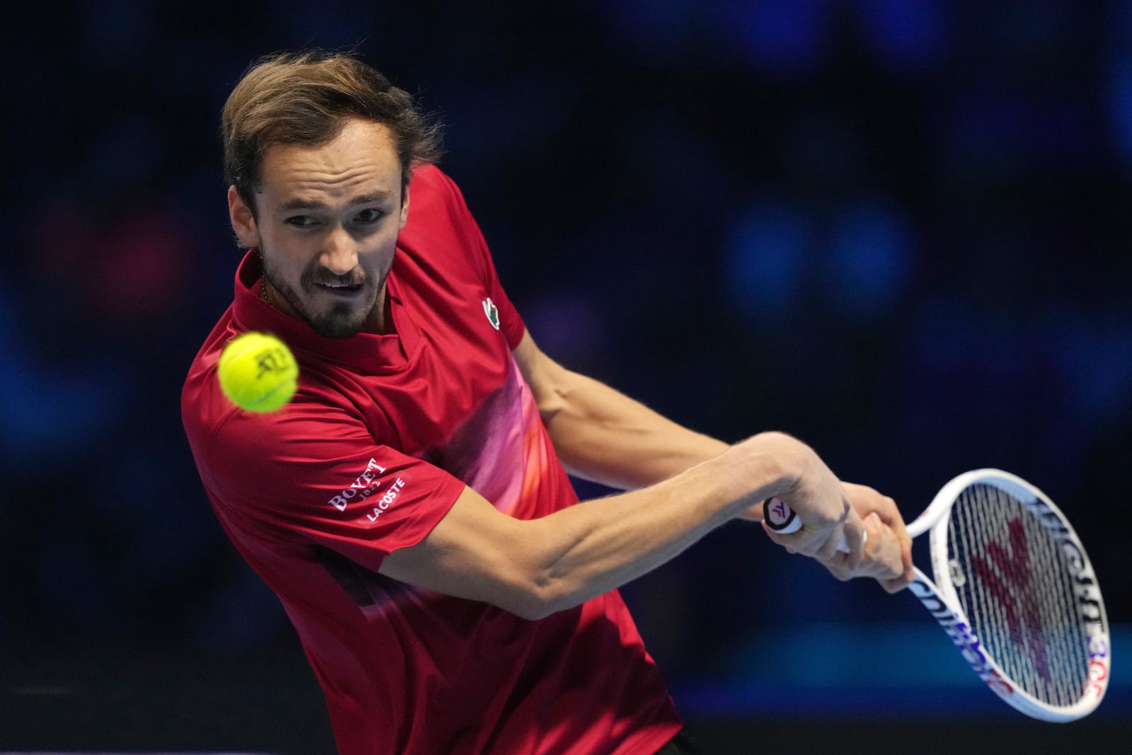 Russia's Daniil Medvedev returns the ball to Italy's Jannik Sinner during their singles tennis match of the ATP World Tour Finals at the Inalpi Arena, in Turin, Italy, Thursday, Nov. 14, 2024. (AP Photo/Antonio Calanni)