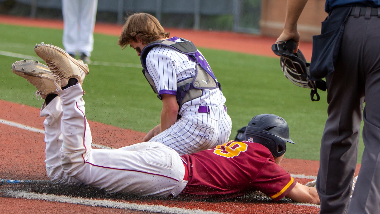 Northeastern's Preston Graves scores on a grounder by Dylan Haggy in the third inning of Thursday's Division III region semifinal against Cincinnati Hills Christian Academy at Wright State. CONTRIBUTED/Jeff Gilbert