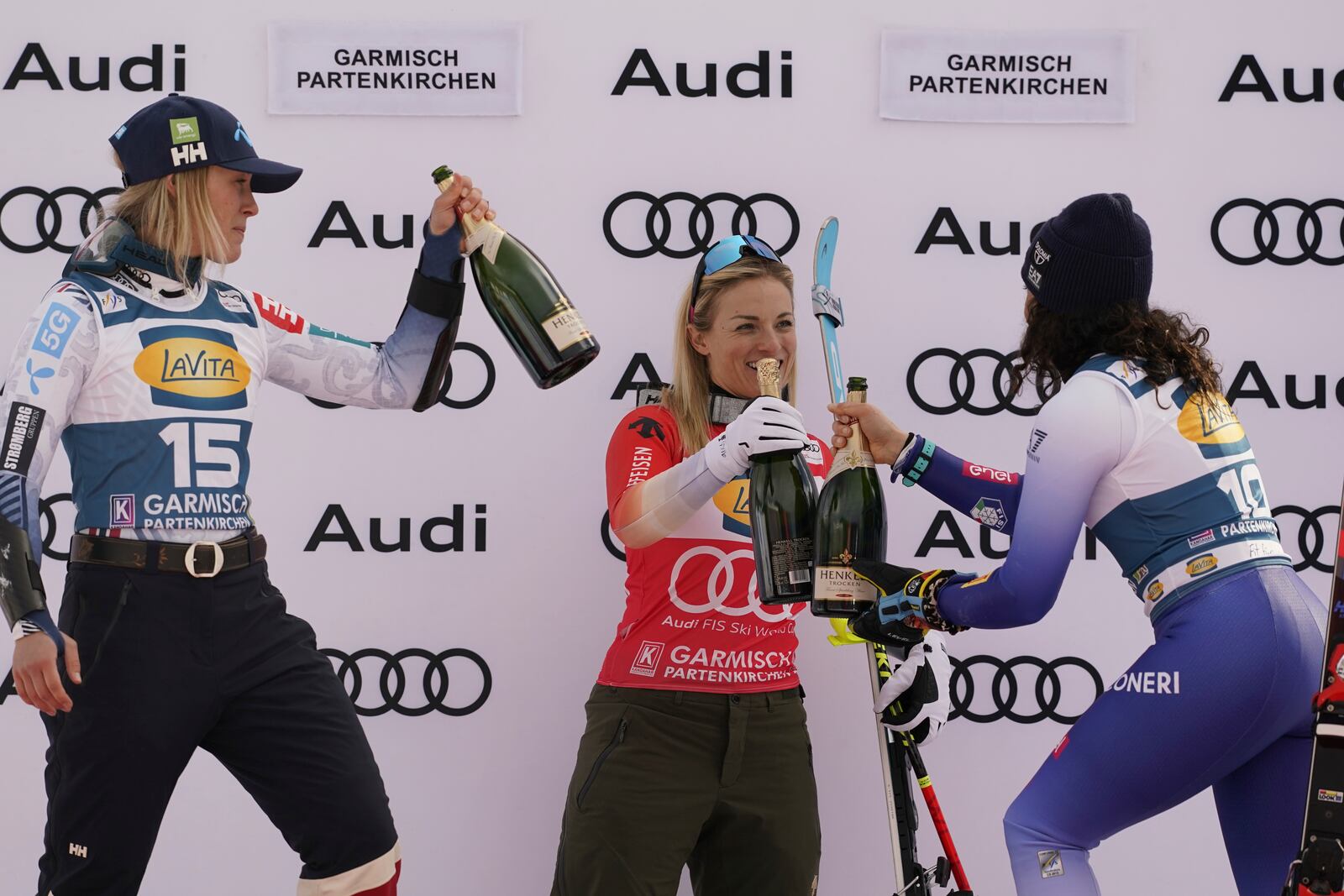 From left, second placed Norway's Kajsa Vickhoff Lie, the winner Switzerland's Lara Gut Behrami and third placed Italy's Federica Brignone celebrate after an alpine ski, women's World Cup super G, in Garmisch, Germany, Sunday, Jan. 26, 2025. (AP Photo/Piermarco Tacca)