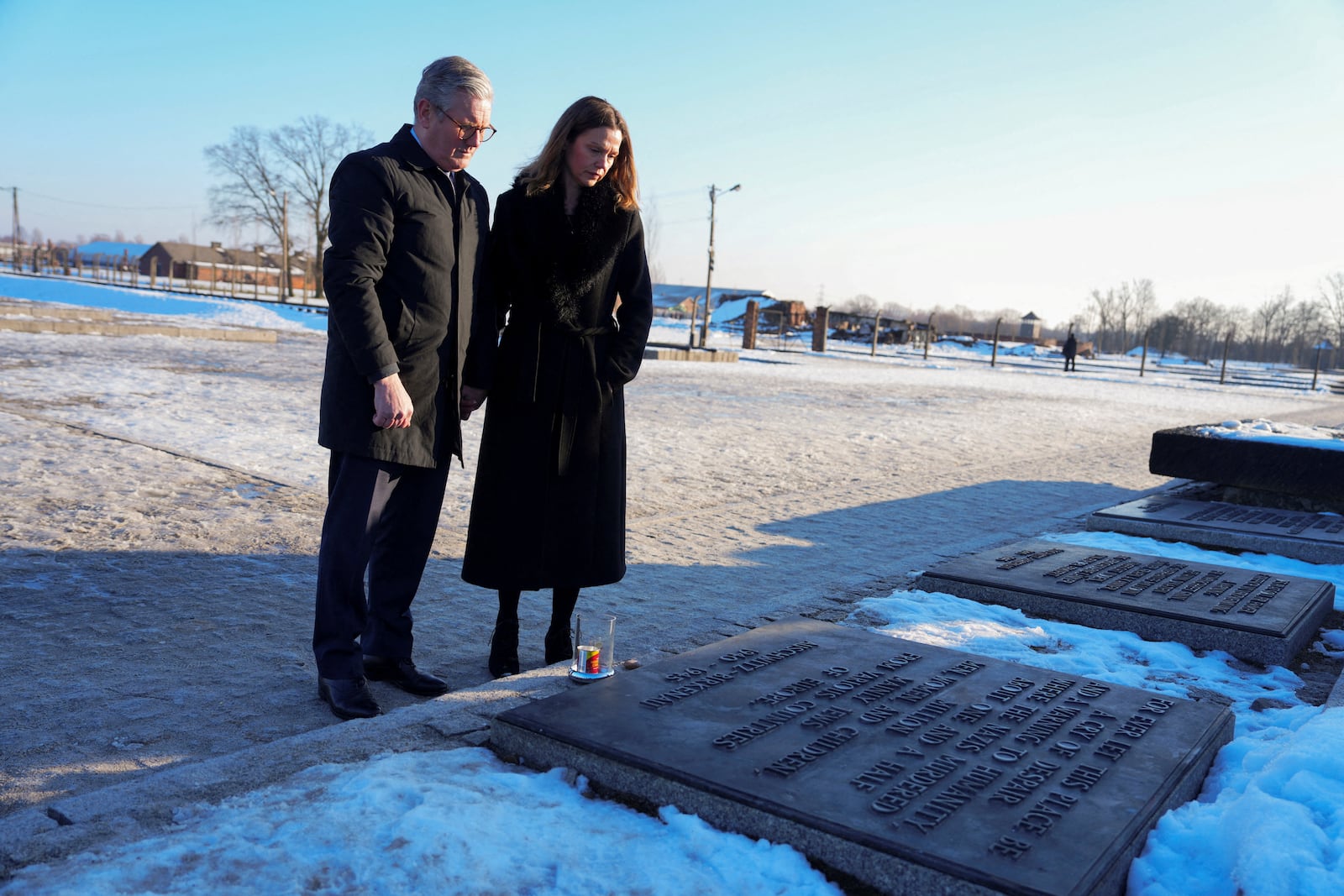 Britain's Prime Minister Keir Starmer and his wife Victoria Starmer visit the Memorial And Museum Auschwitz-Birkenau, a former Nazi German concentration and extermination camp, in Oswiecim, Poland, Friday Jan. 17, 2025. (Aleksandra Szmigiel/Pool via AP)