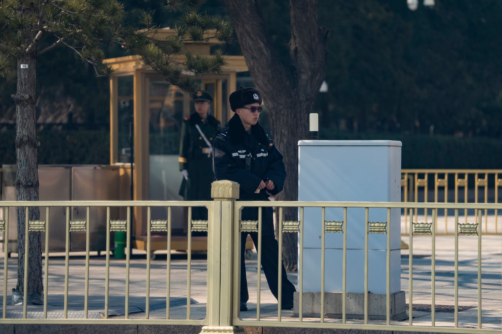 Security personnel stand guard near the Great Hall of the People ahead of the National People's Congress in Beijing, on Feb. 28, 2025. (AP Photo/Ng Han Guan)