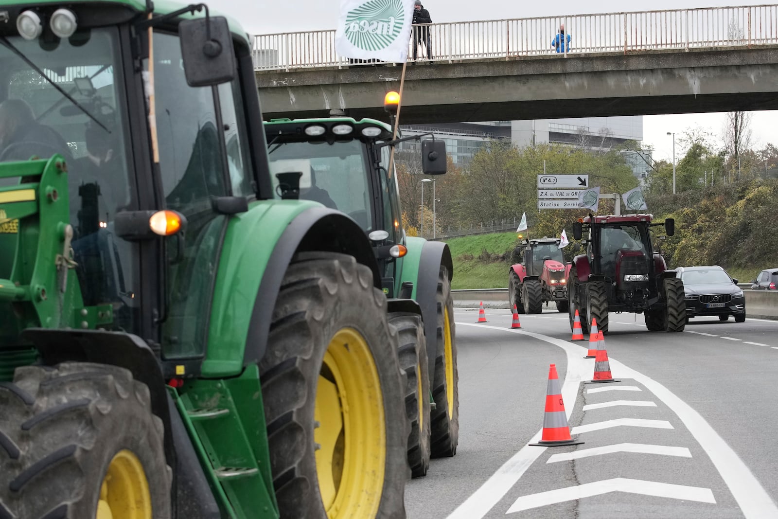 Farmers block a speedway to protest the EU-Mercosur trade agreement, Monday, Nov. 18, 2024 in Velizy-Villacoublay outside Paris. (AP Photo/Christophe Ena)