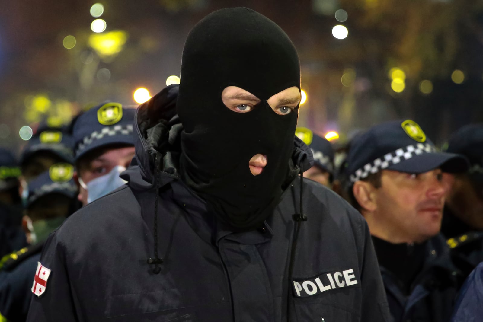 Police block a street during a rally against the results of the parliamentary elections amid allegations that the vote was rigged in Tbilisi, Georgia Tuesday, Nov. 19, 2024. (AP Photo/Zurab Tsertsvadze)