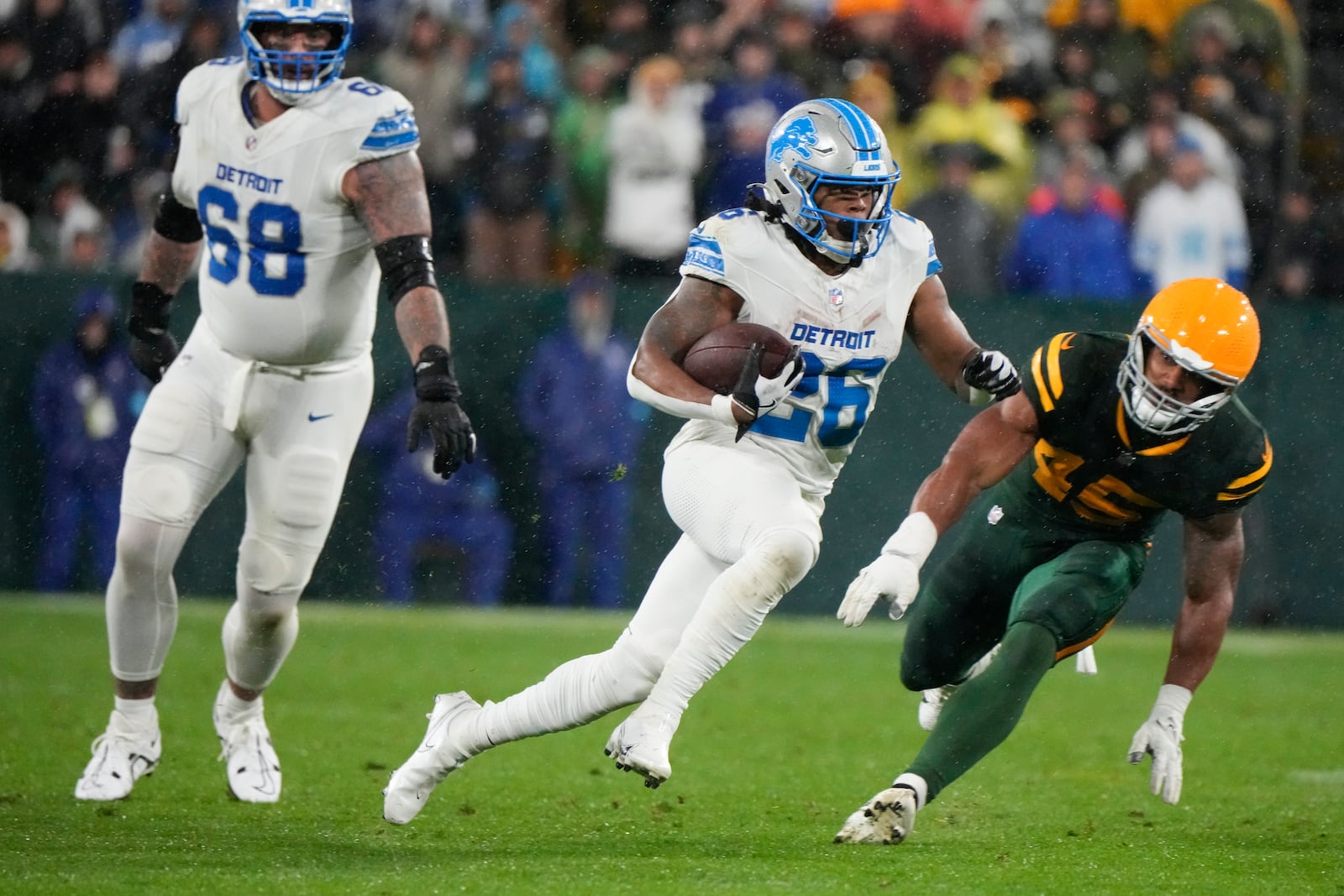 Detroit Lions running back Jahmyr Gibbs (26) runs against the Green Bay Packers during the second half of an NFL football game Sunday, Nov. 3, 2024, in Green Bay, Wis. (AP Photo/Morry Gash)