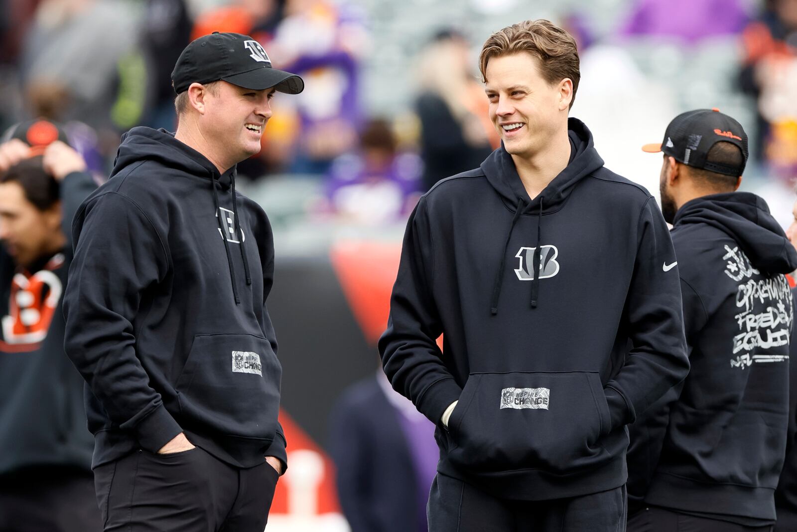 Cincinnati Bengals quarterback Joe Burrow, right, talks to head coach Zac Taylor before an NFL football game against the Minnesota Vikings, Saturday, Dec. 16, 2023, in Cincinnati. (AP Photo/Jay LaPrete)