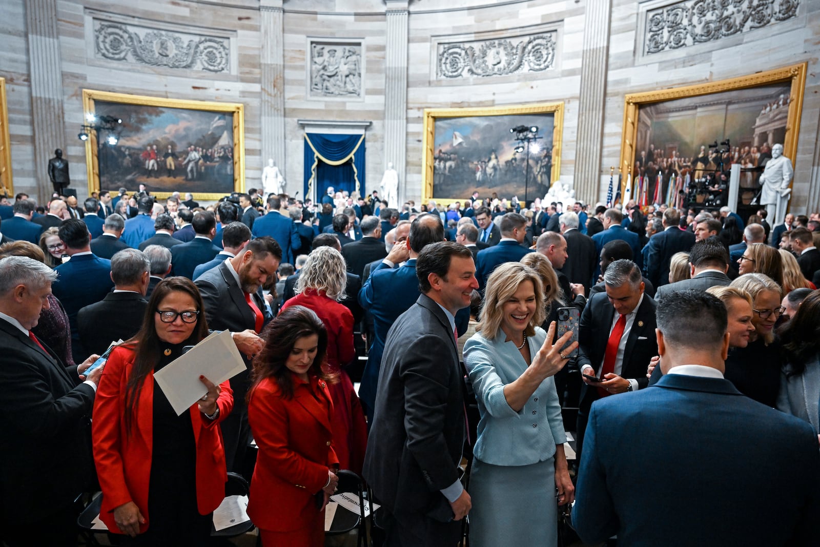 Attendees arrive before the 60th Presidential Inauguration in the Rotunda of the U.S. Capitol in Washington, Monday, Jan. 20, 2025. (Kenny Holston/The New York Times via AP, Pool)