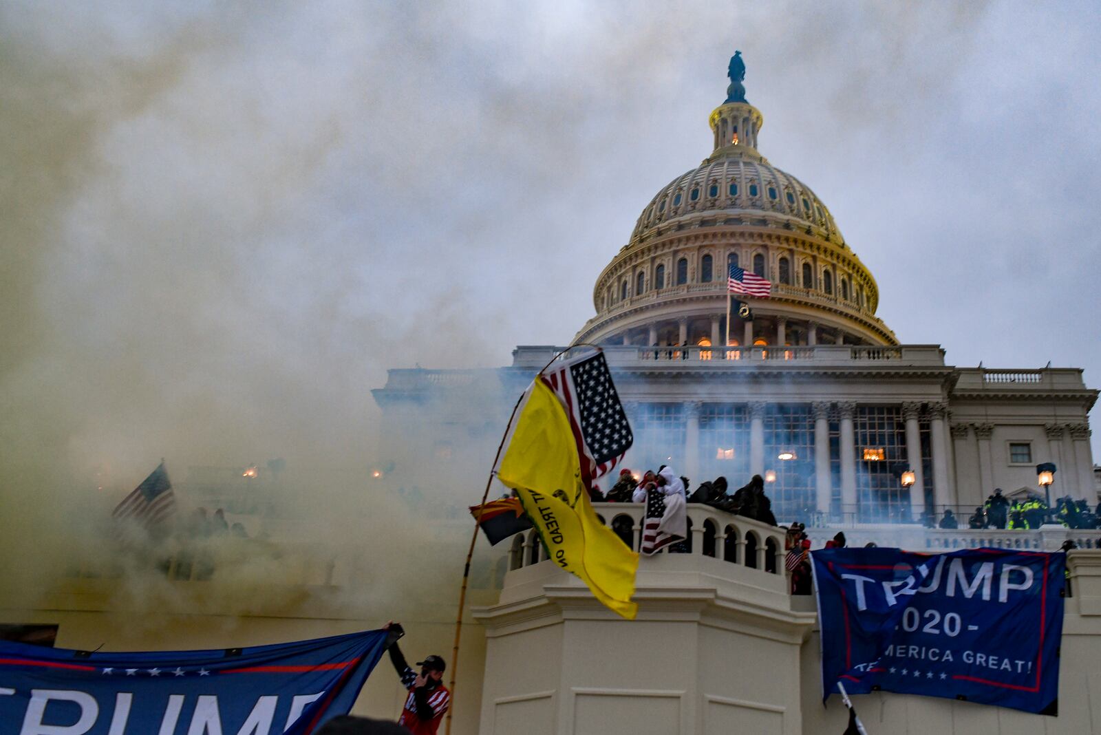 FILE — Supporters of then President Donald Trump storm the U.S. Capitol in Washington, Jan. 6, 2021. An examination by The New York Times of 77 democracy-bending days shows how a lie that President Donald Trump had been grooming for years finally overwhelmed the Republican Party and was propelled forward by new and more radical lawyers, political organizers, financiers and right-wing media. (Kenny Holston/The New York Times)