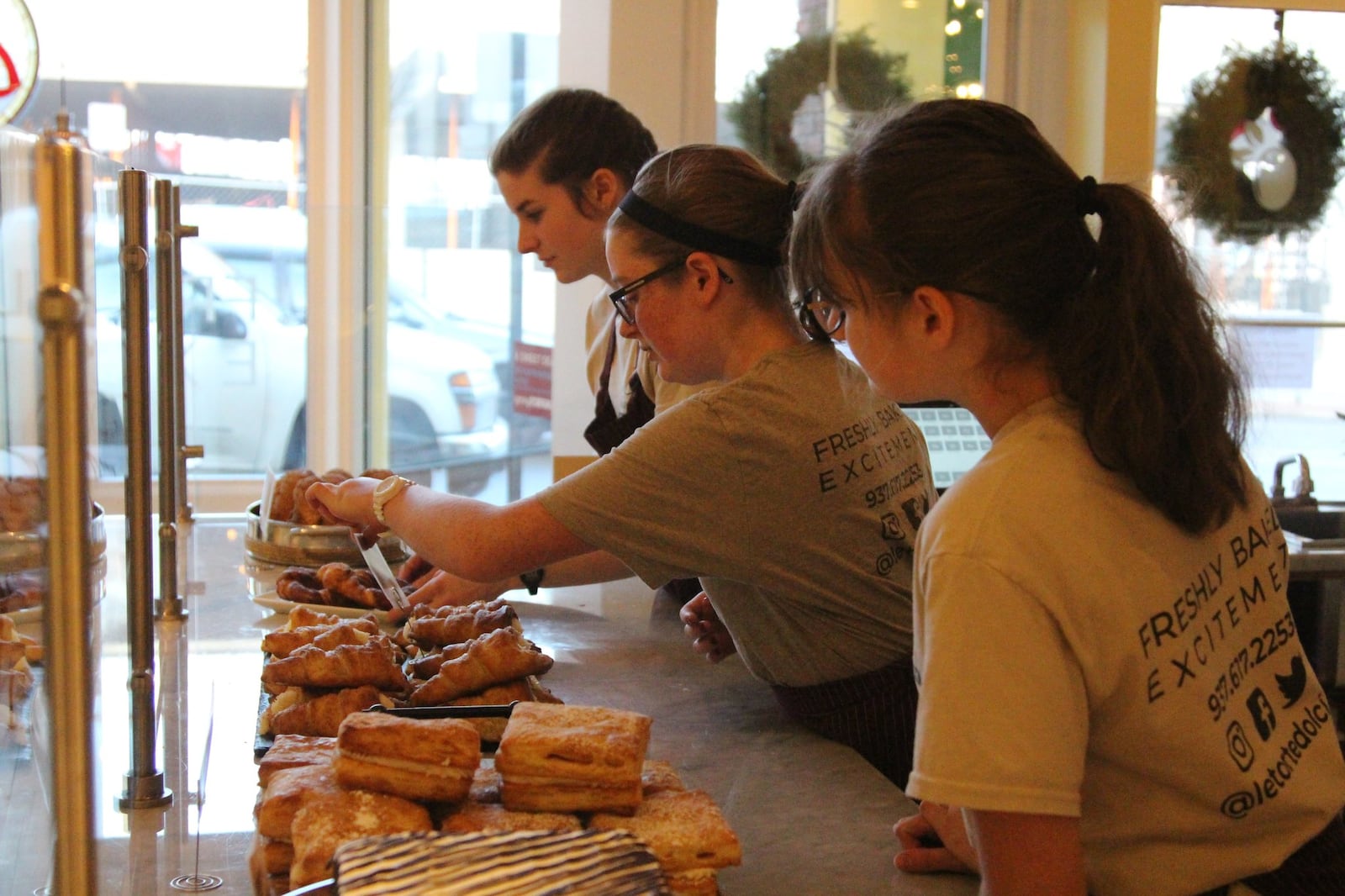 Ella Freeman adjusts a plate of pastries at her parents’ downtown Springfield Bakery Le Torte Dolci. HASAN KARIM/ STAFF