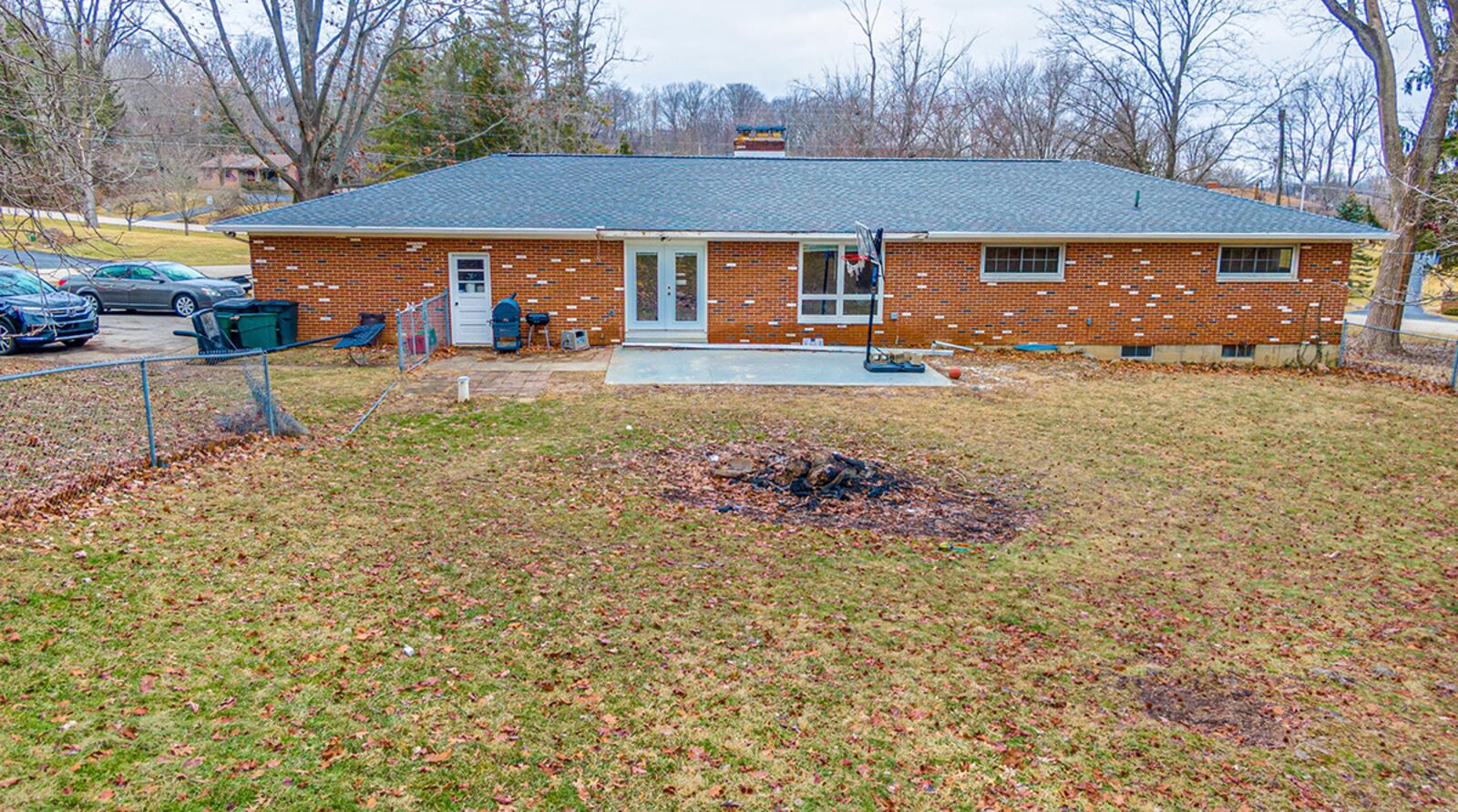 The rear is fully fenced with chain link and has a concrete patio and mature trees. CONTRIBUTED PHOTO